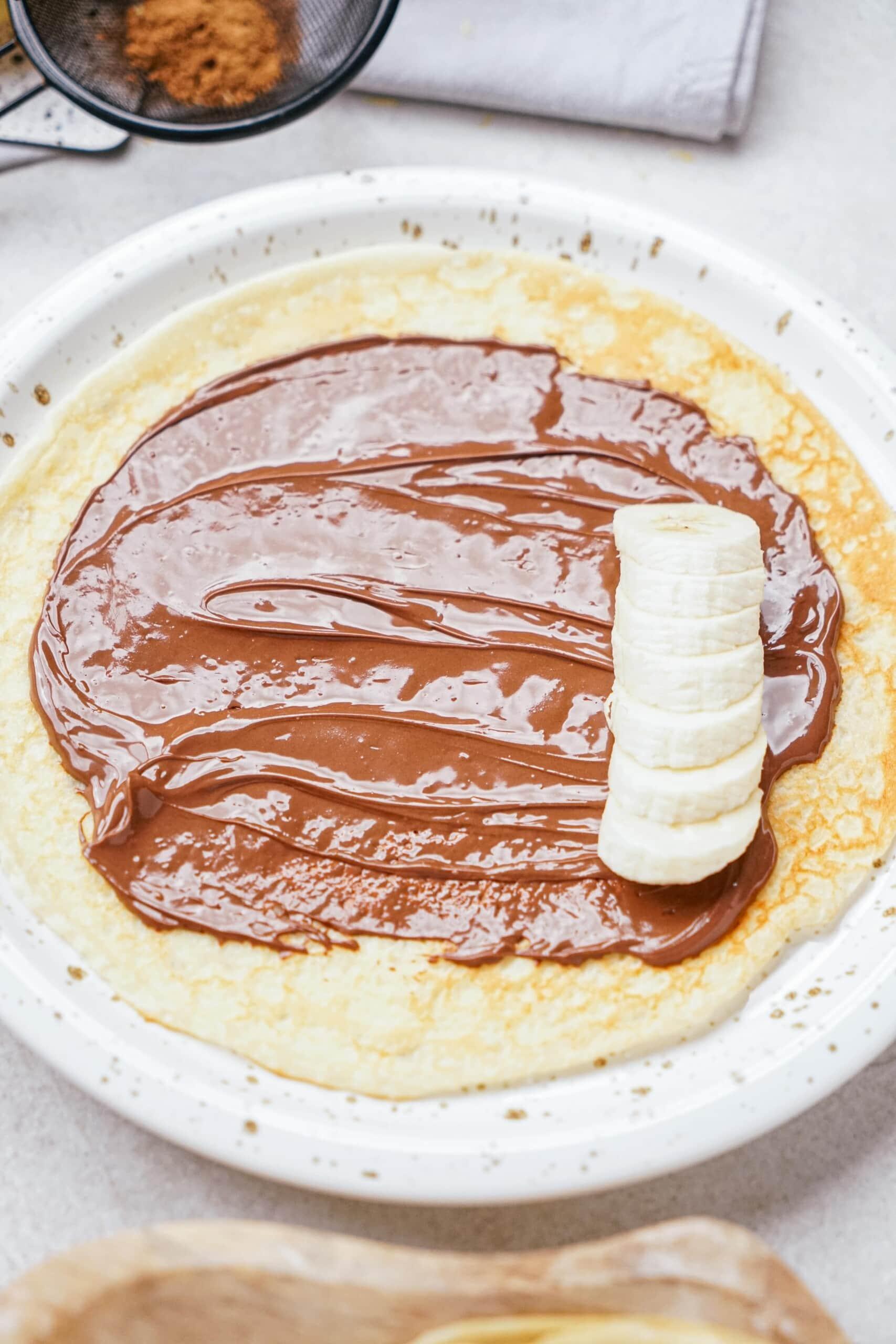 nutella and sliced bananas on a crepe