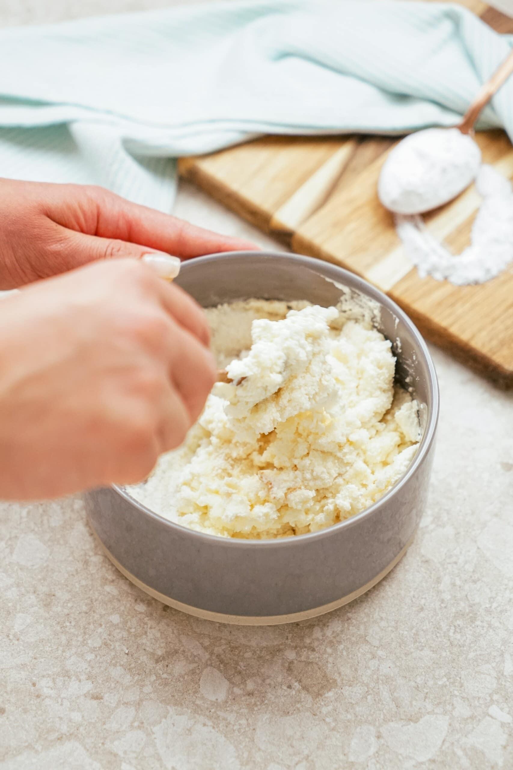 mixing cream cheese ingredients together in a bowl