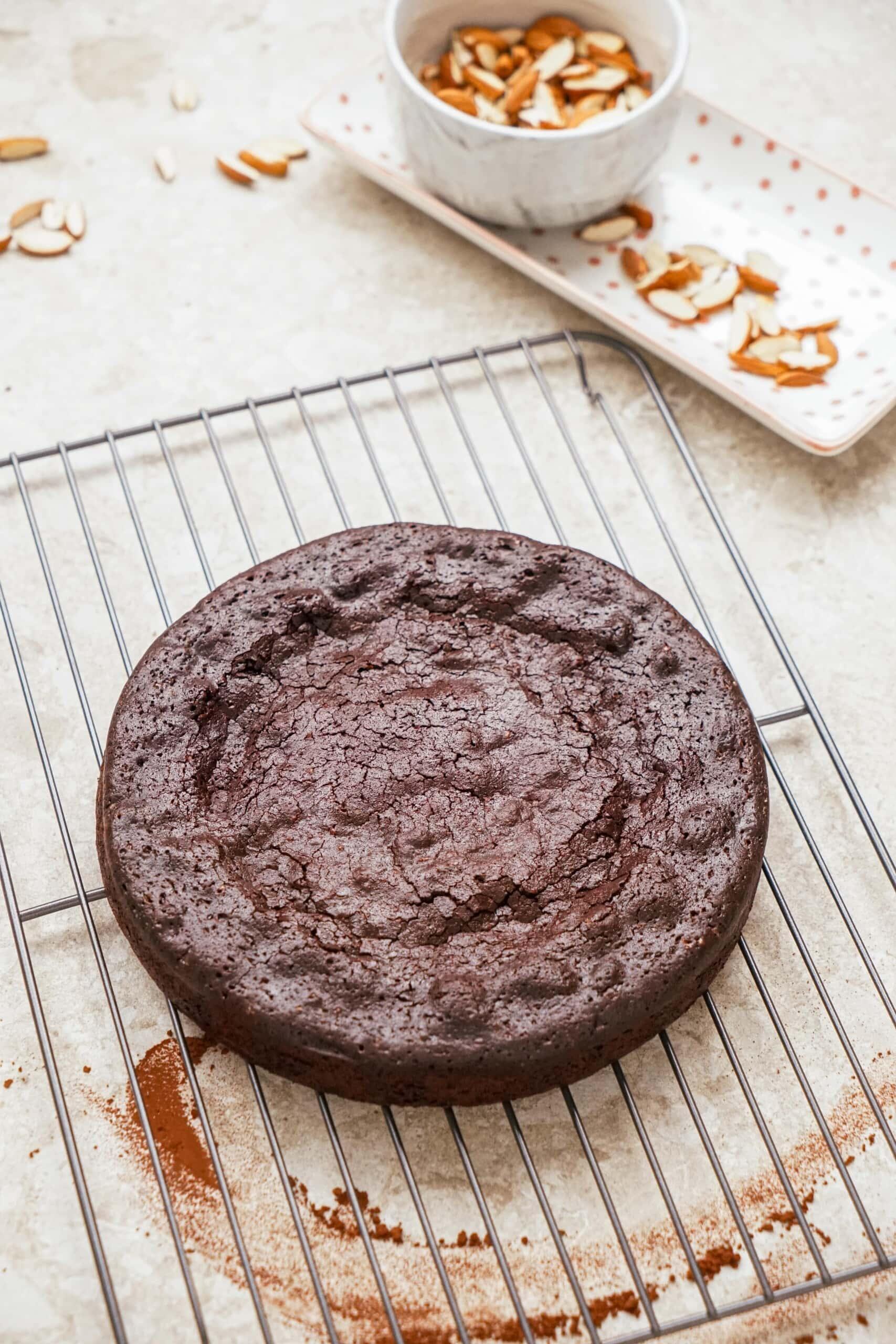 flourless chocolate cake on a cooling rack