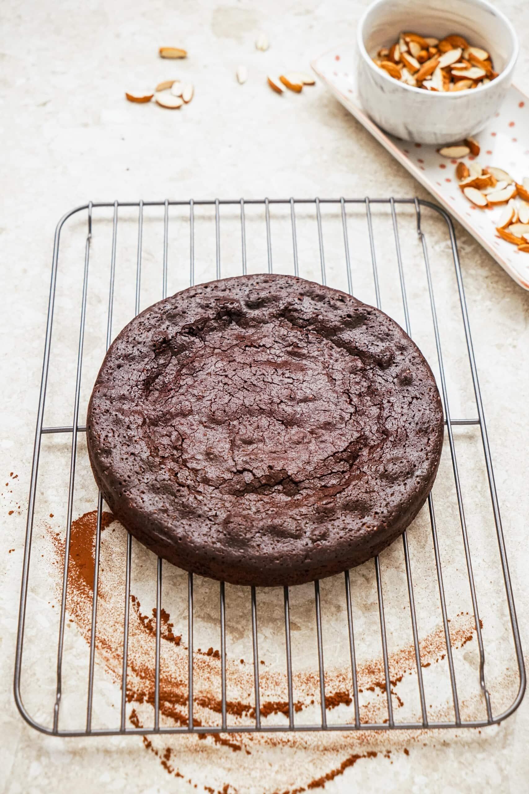 flourless chocolate cake cooling on cooling rack