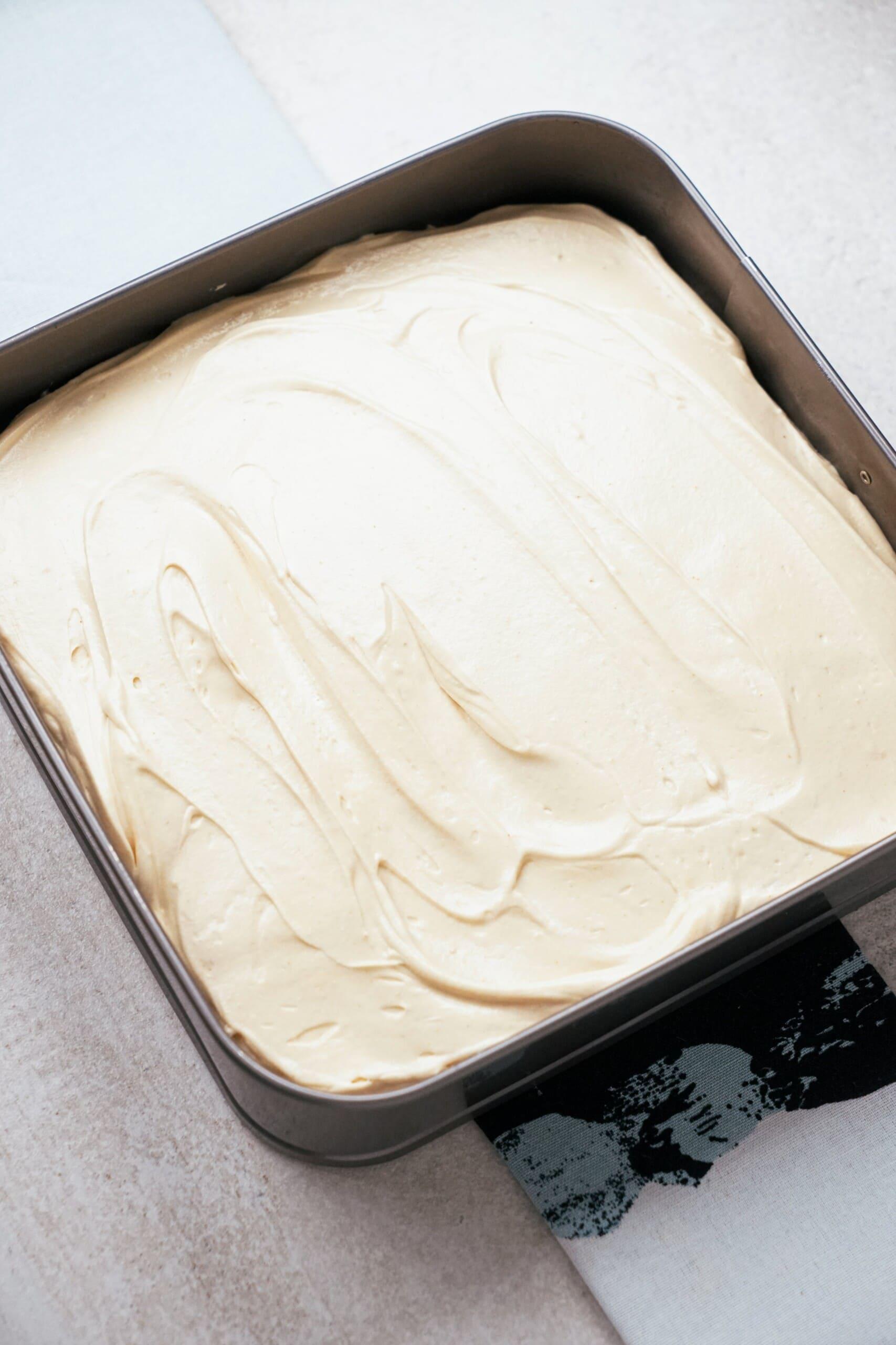 peanut butter brownie pie frosted in a baking pan