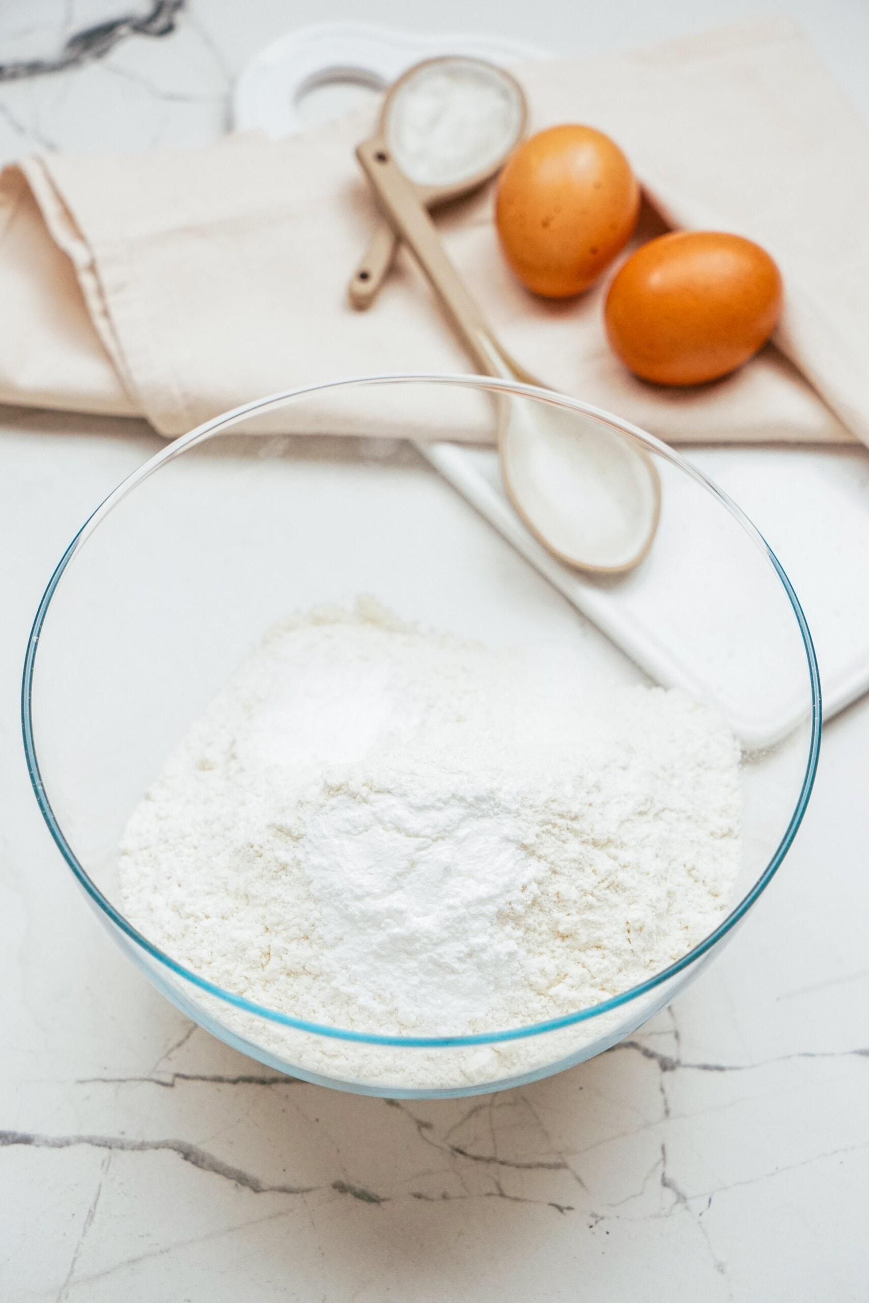 dry cake ingredients in a glass bowl