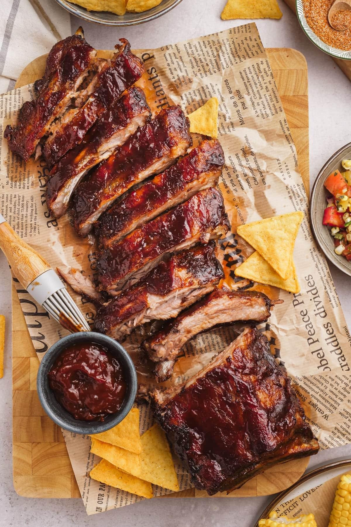 oven baked ribs sliced on serving board