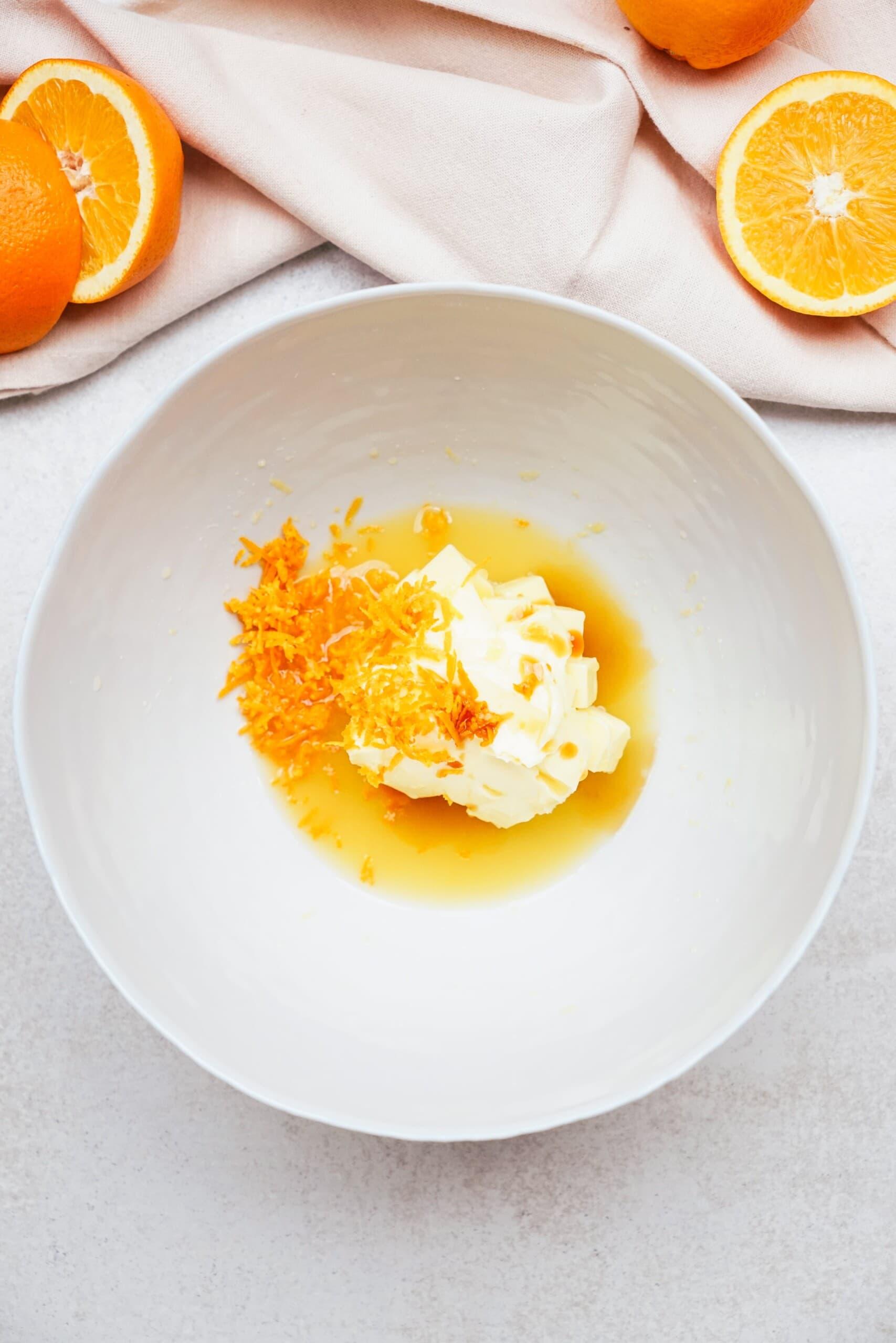 orange frosting ingredients in a mixing bowl