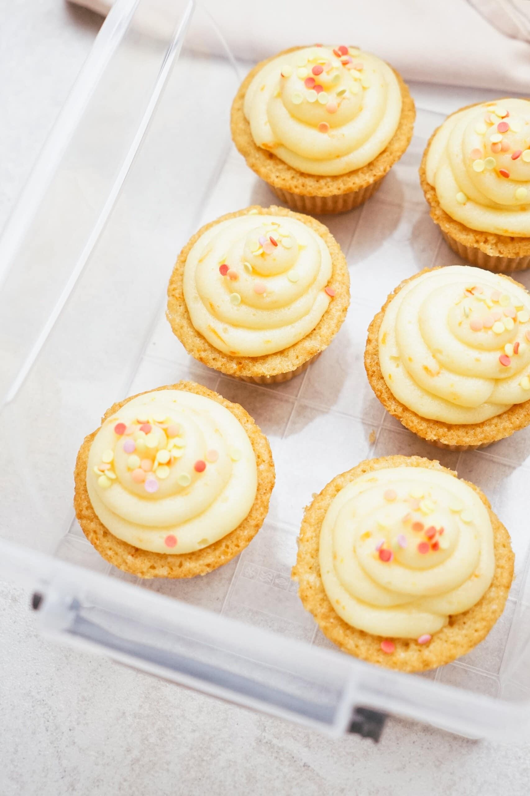orange cupcakes in a container for storing