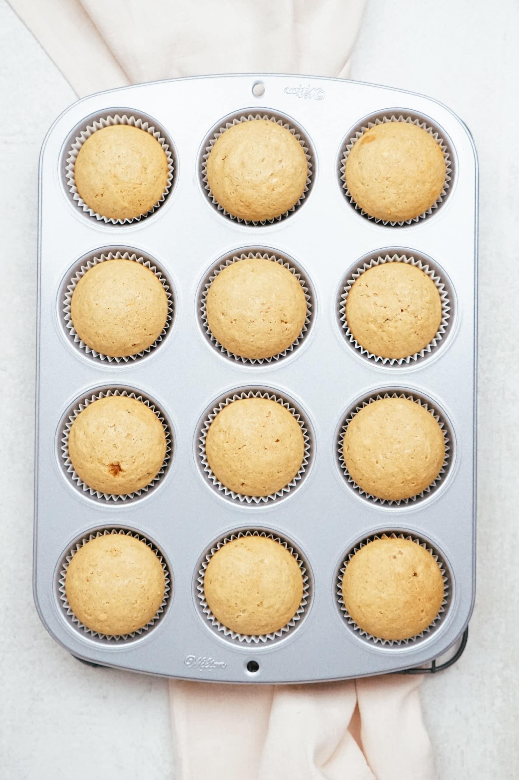 baked sweet potato cupcakes in muffin tins