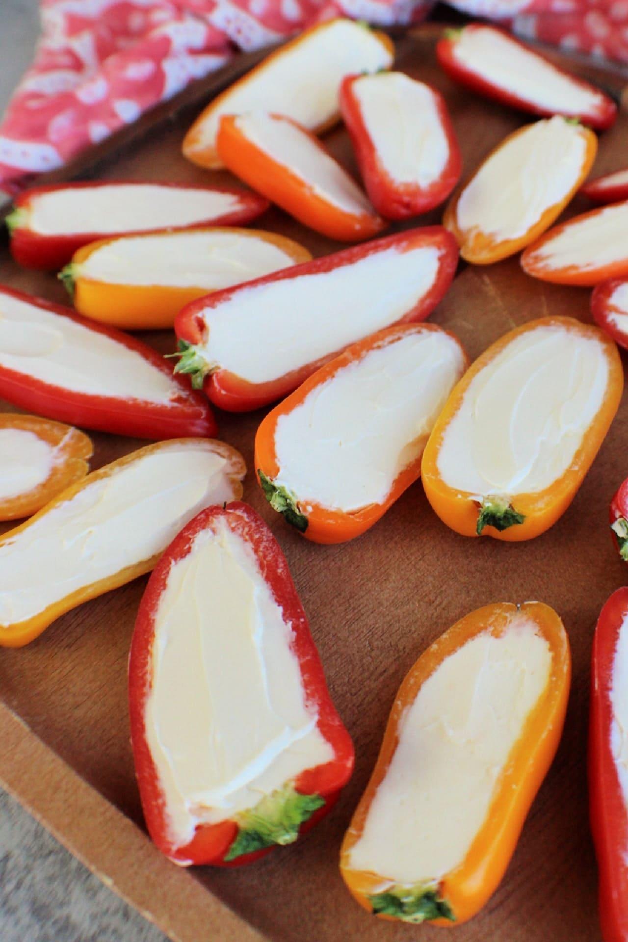 sliced peppers filled and smoothed with cream cheese