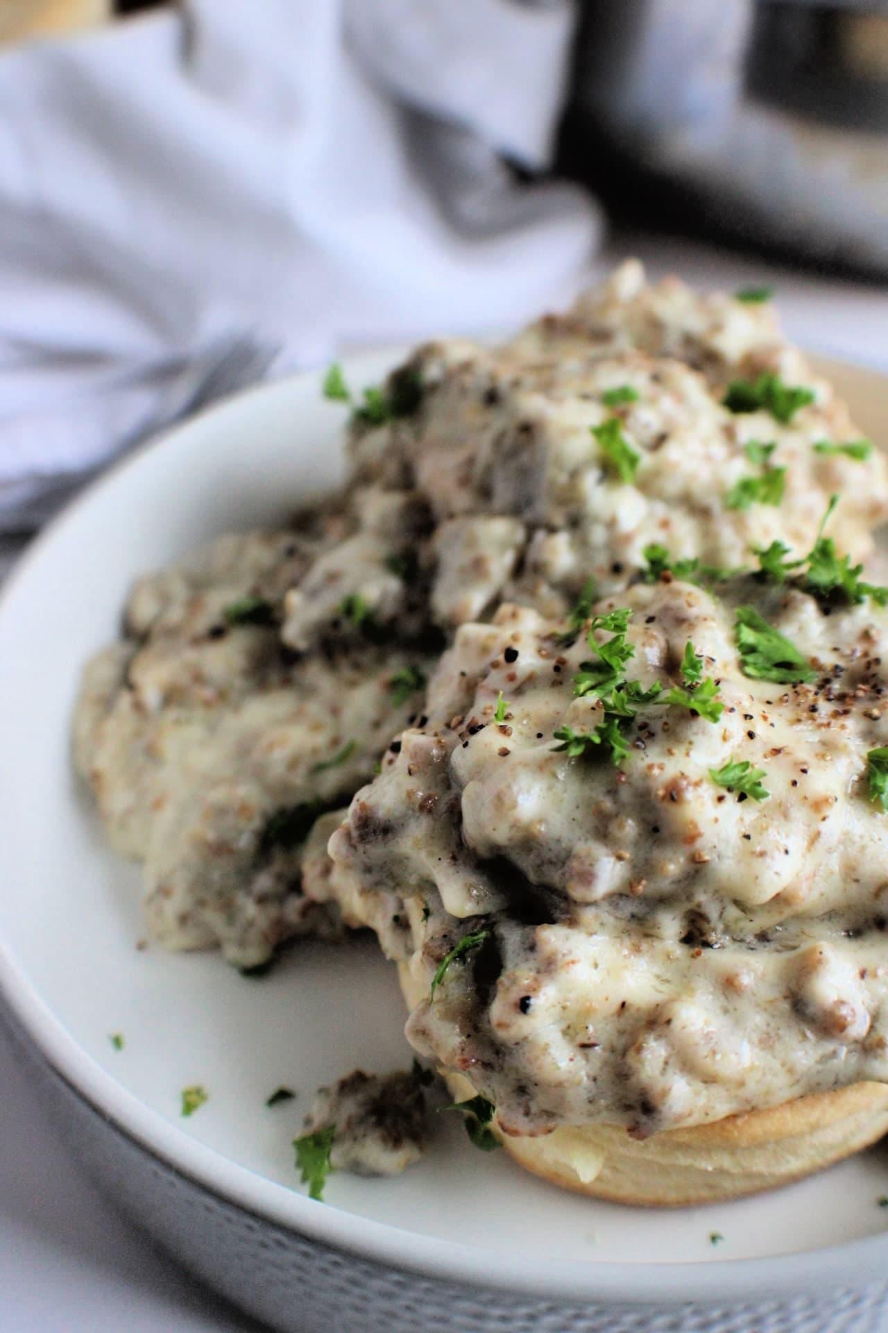 Biscuits and sausage gravy served on a plate