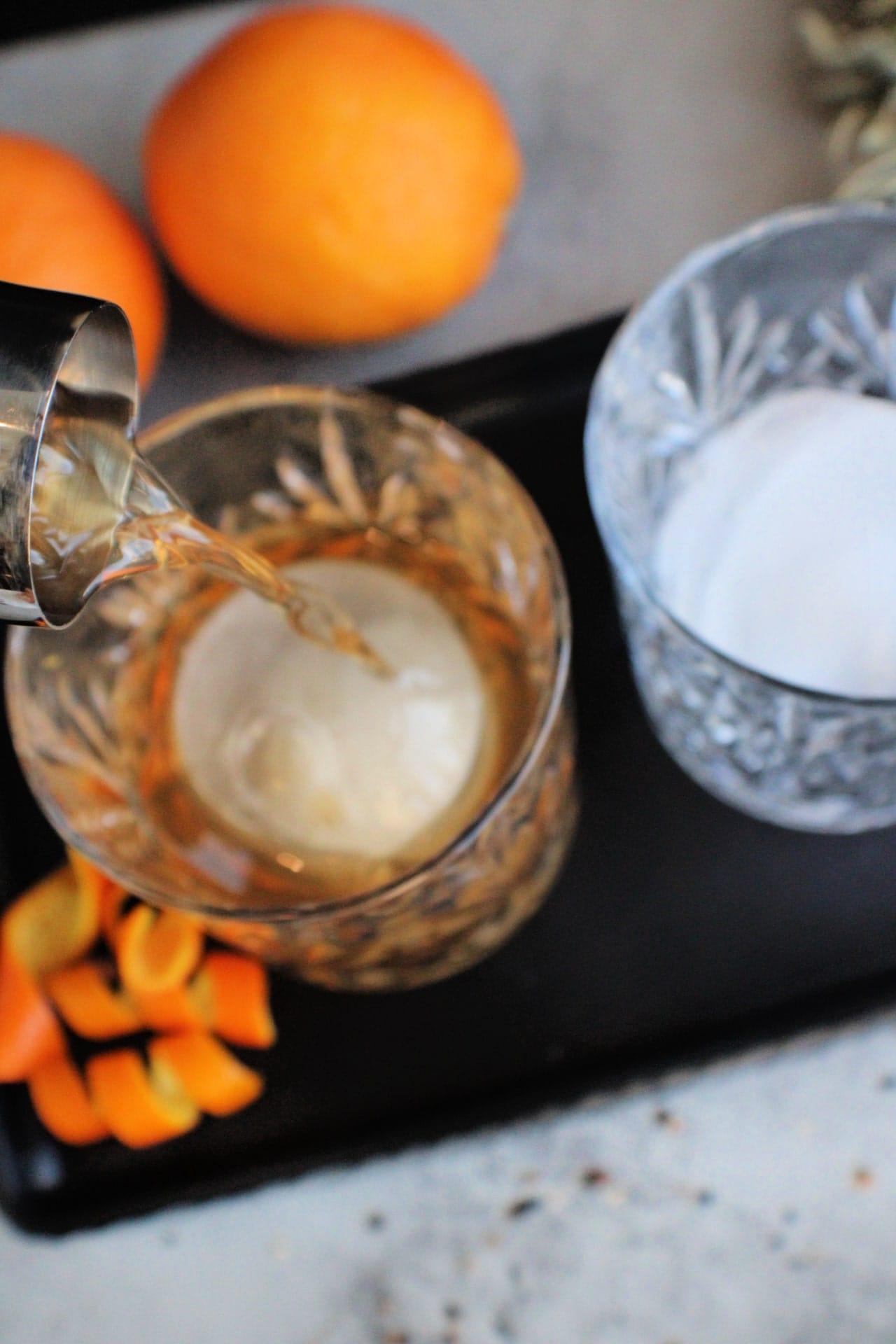 bourbon being poured into a glass