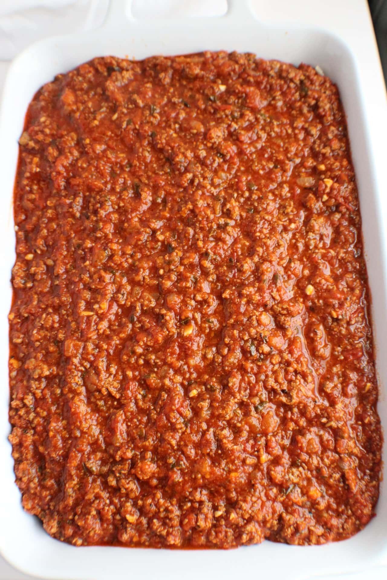 meat sauce poured over the top of cheese mixture and noodles