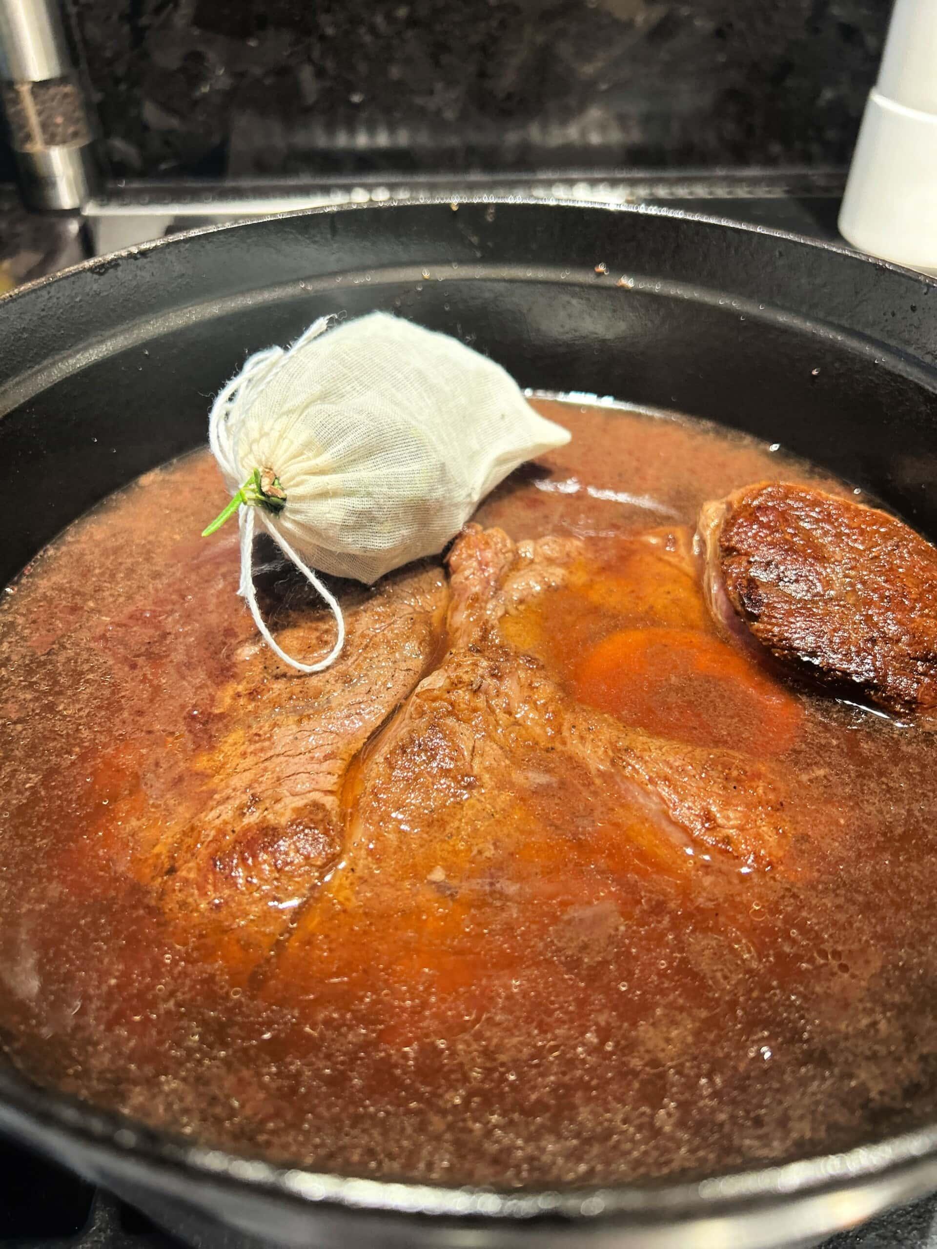 herb sachet added to the roast in the pot