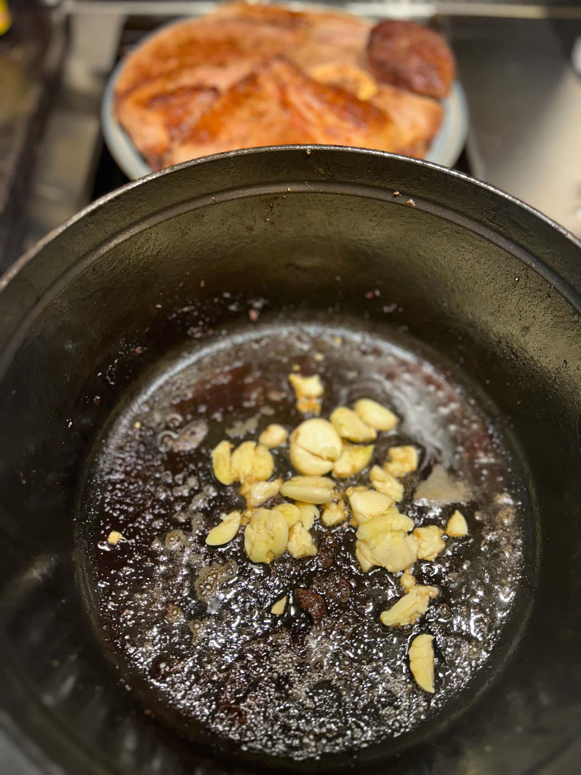 minced garlic added to bottom of a hot dutch oven