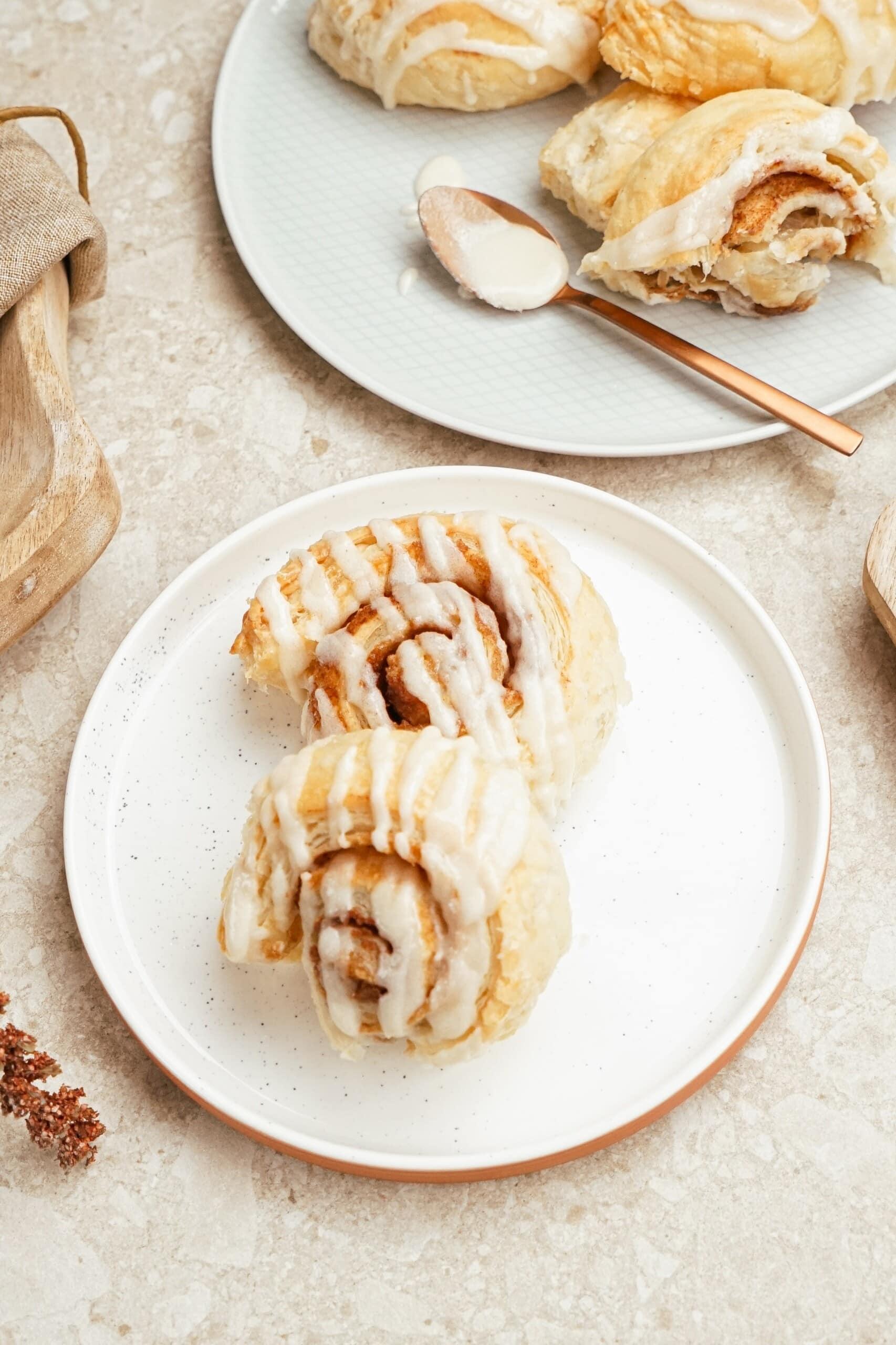 puff pastry cinnamon rolls on a plate on a tablescape