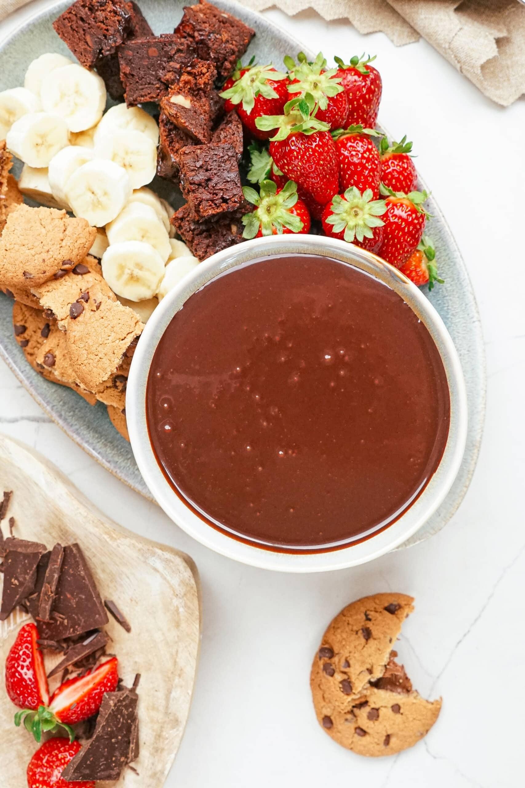 dipping chocolate on a tablescape with dipping items.