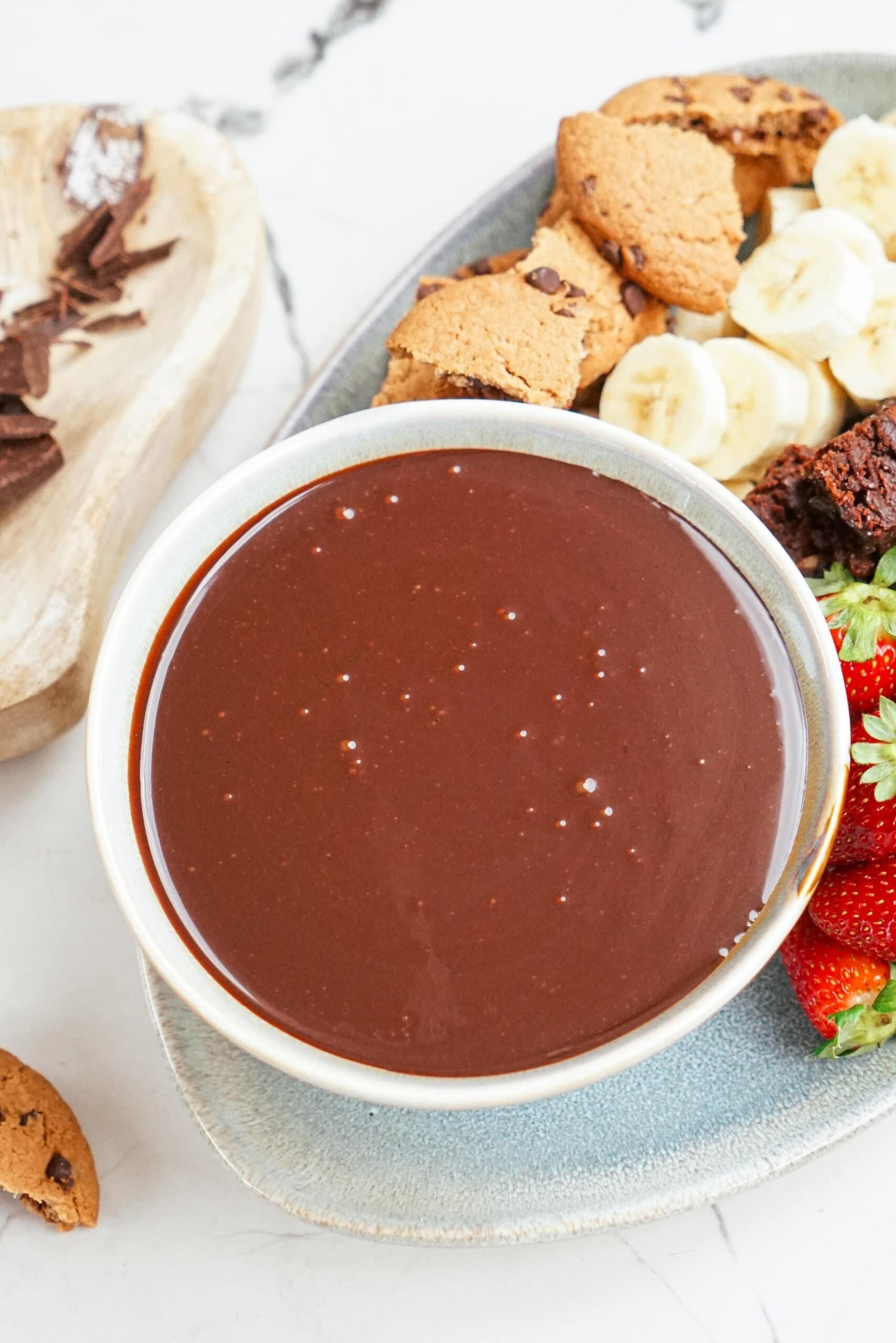 dipping chocolate on a tablescape with dipping items.