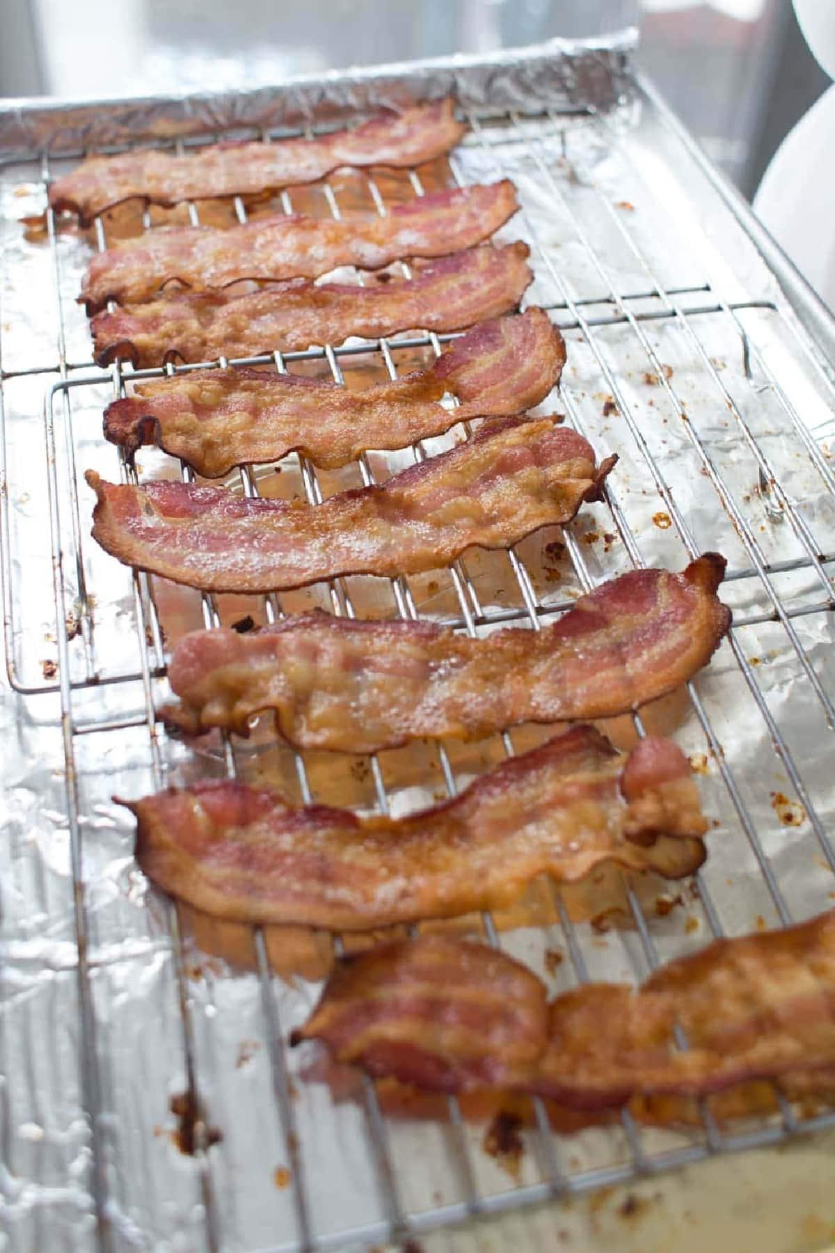cooked bacon on baking sheet with rack