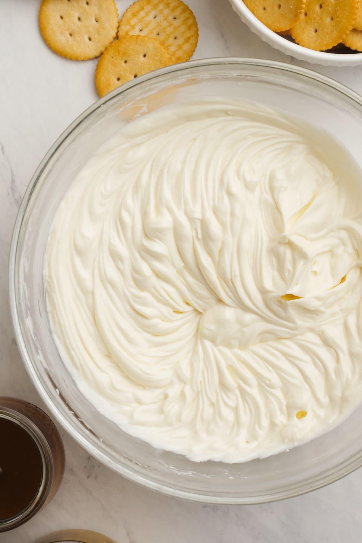 cream cheese and sugar whipped together in a mixing bowl