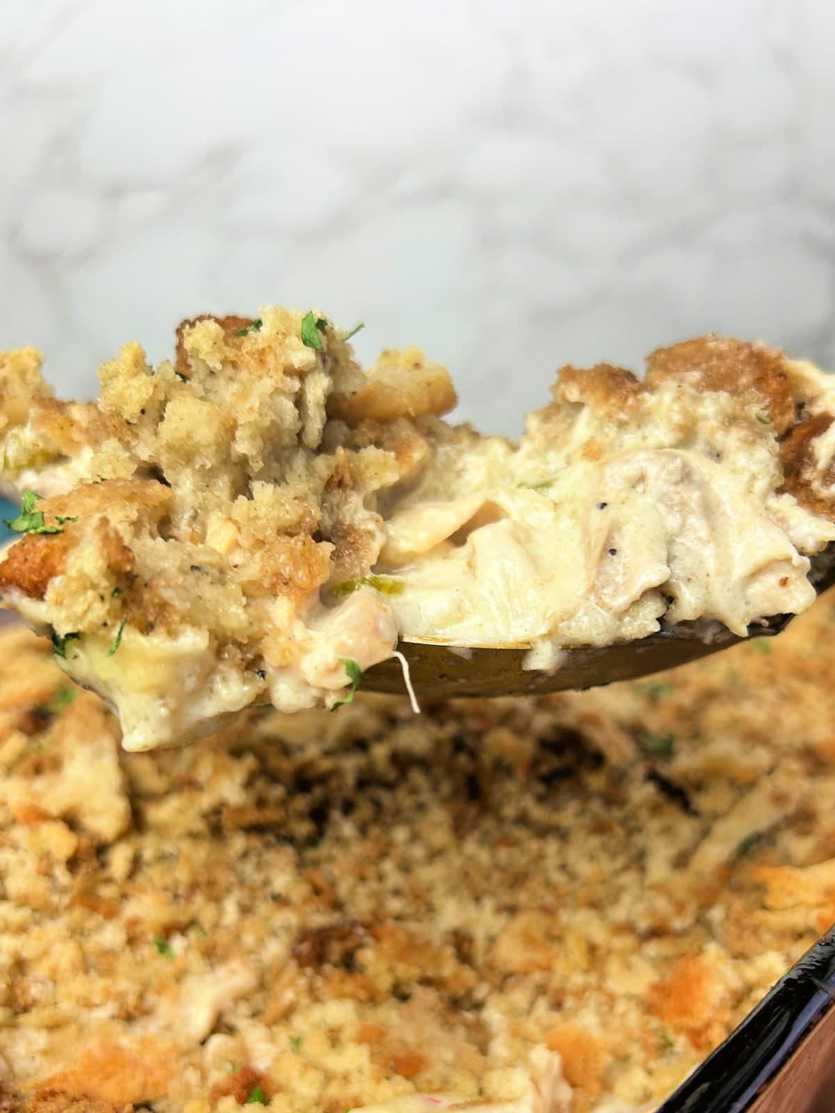 Chicken Stuffing Casserole on a serving spoon