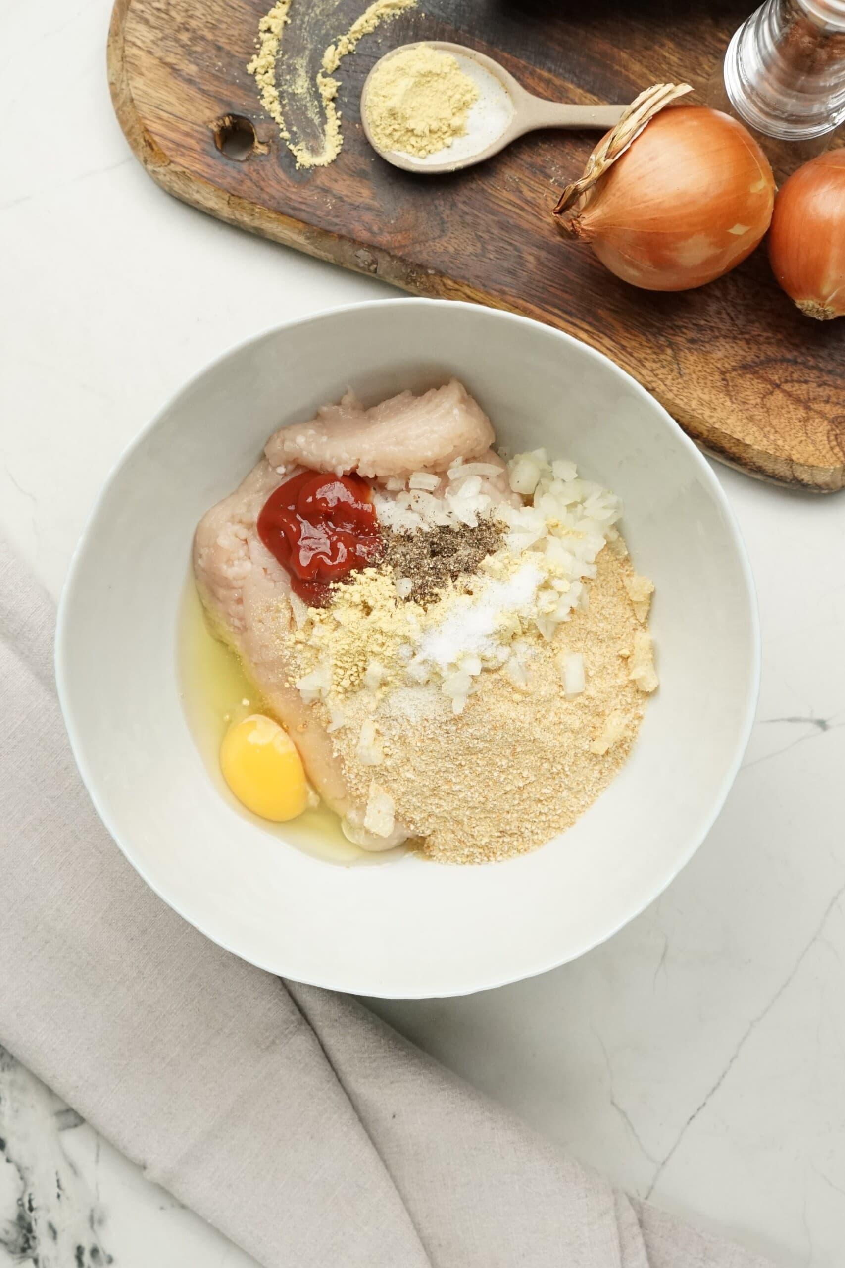 turkey salisbury steak ingredients in a mixing bowl