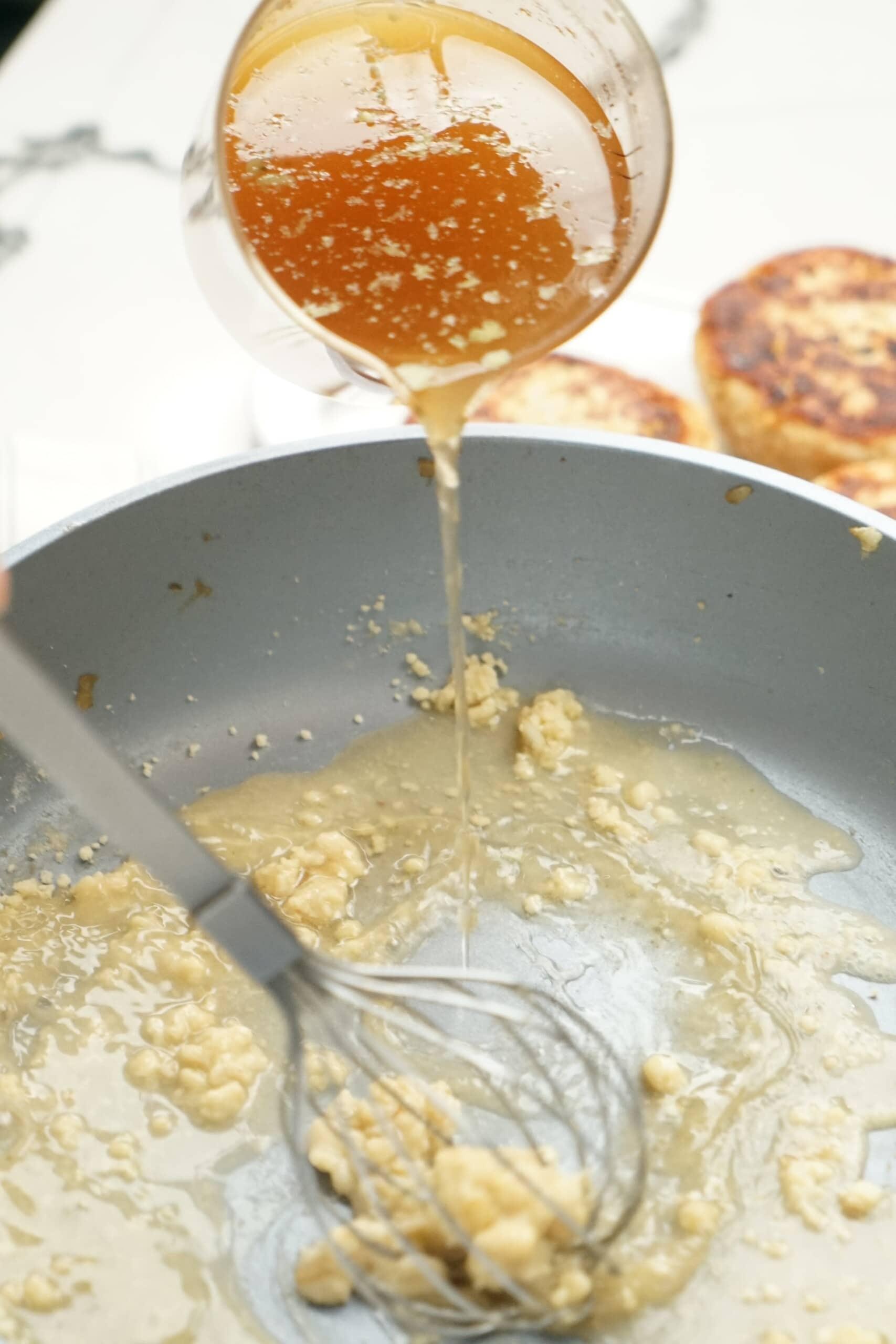 adding beef broth to the roux