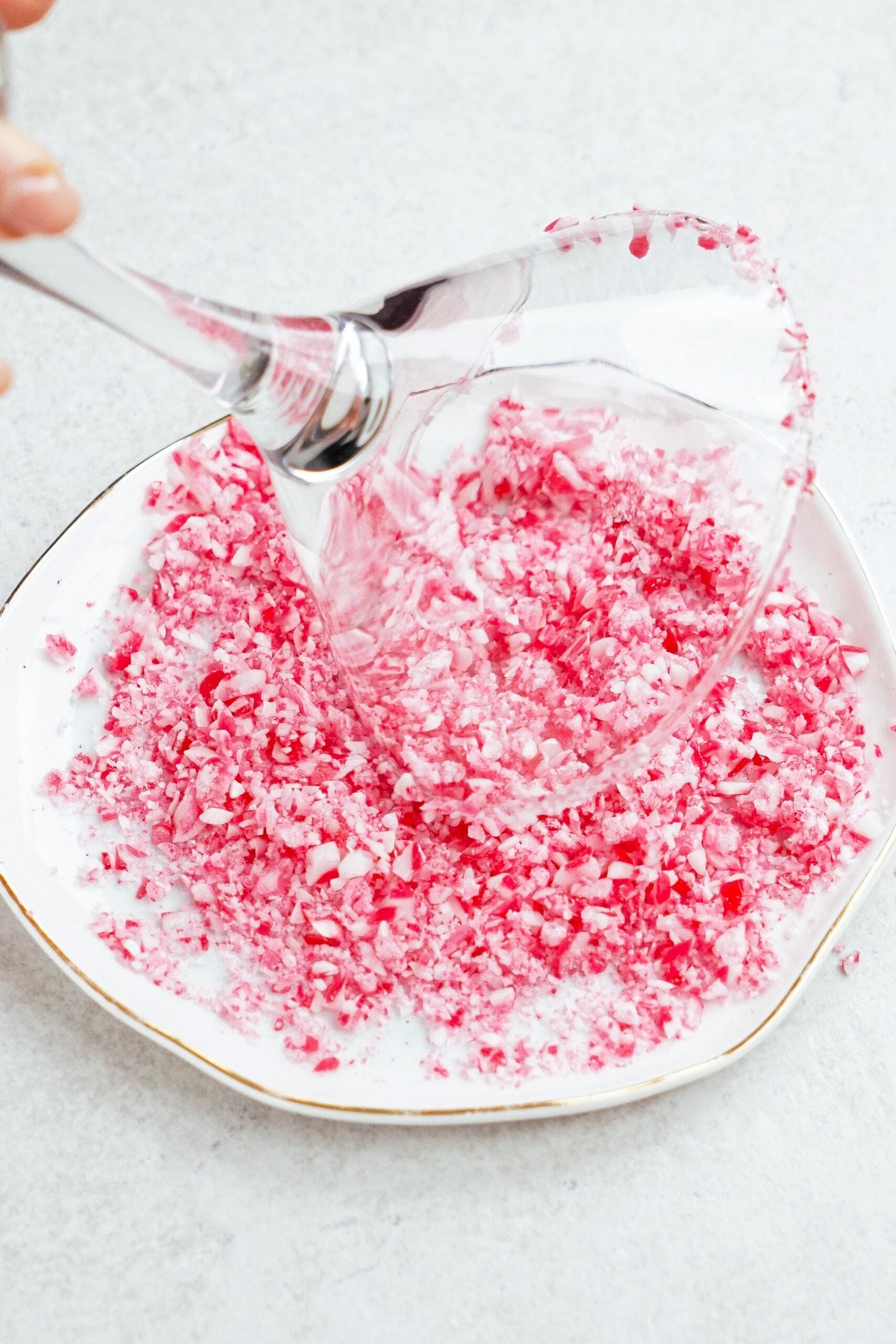 crushed candy canes rimmed on a martini glass
