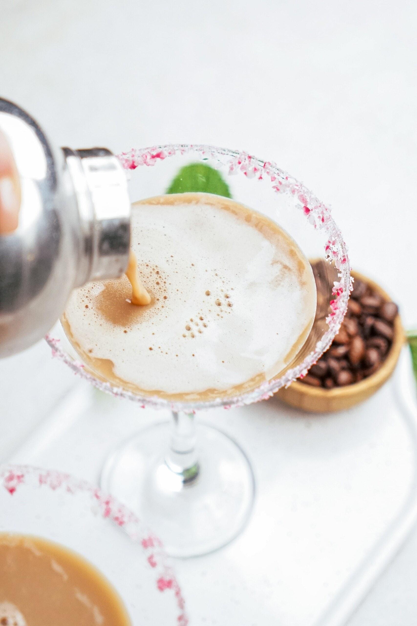 pouring martini into glass