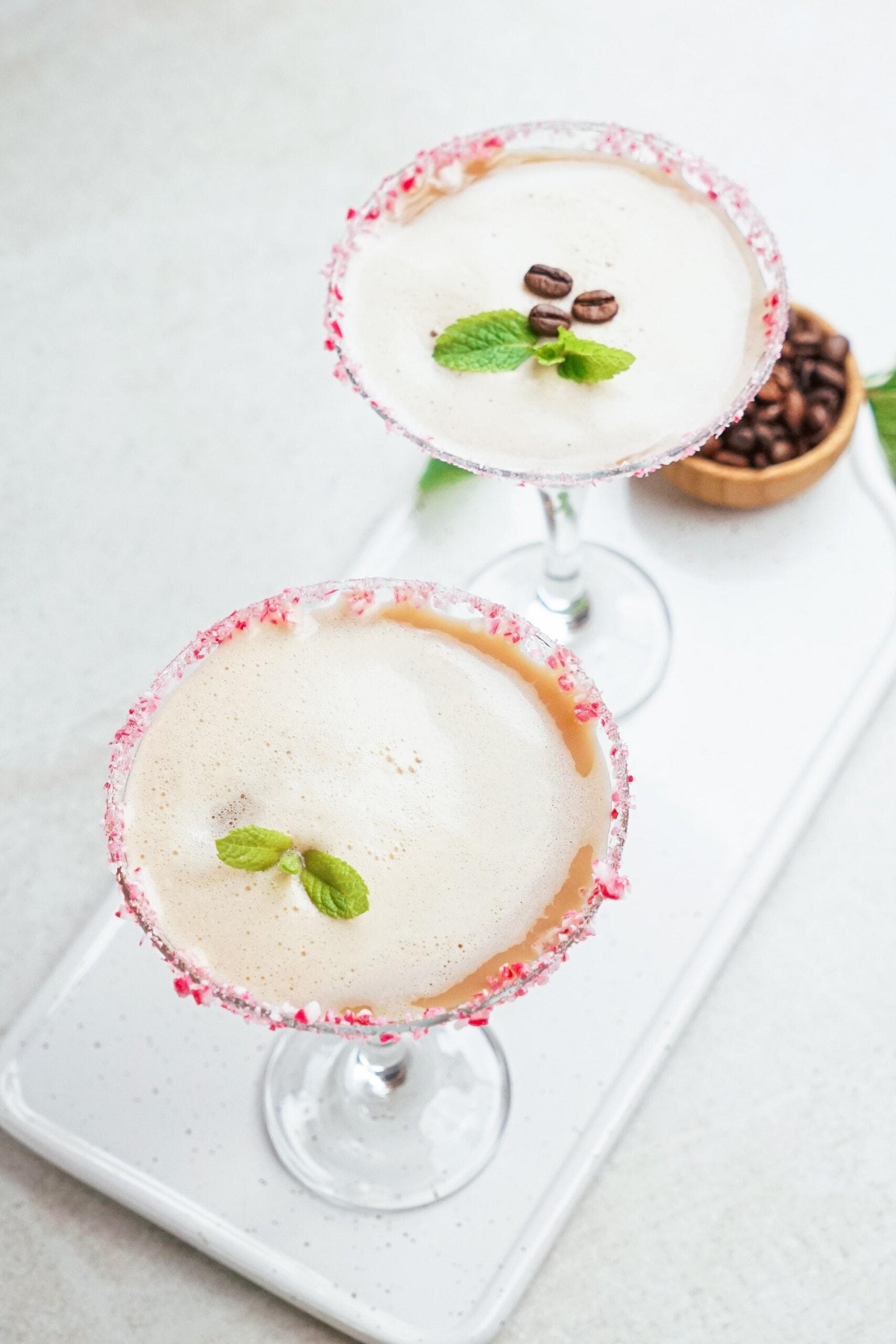 2 martinis with coffee bean and mint garnish