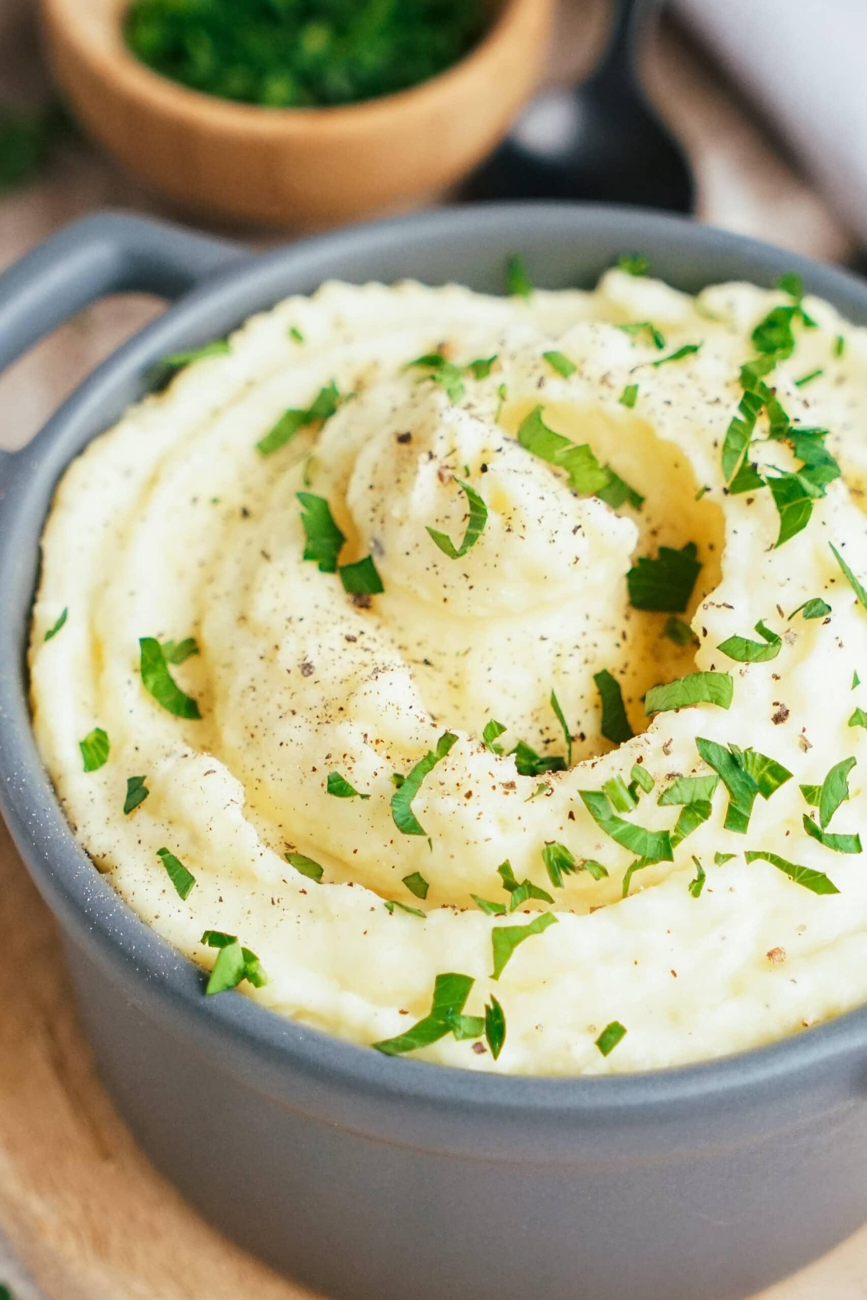 Crockpot Mashed Potatoes mashed potatoes with butter and chives on top