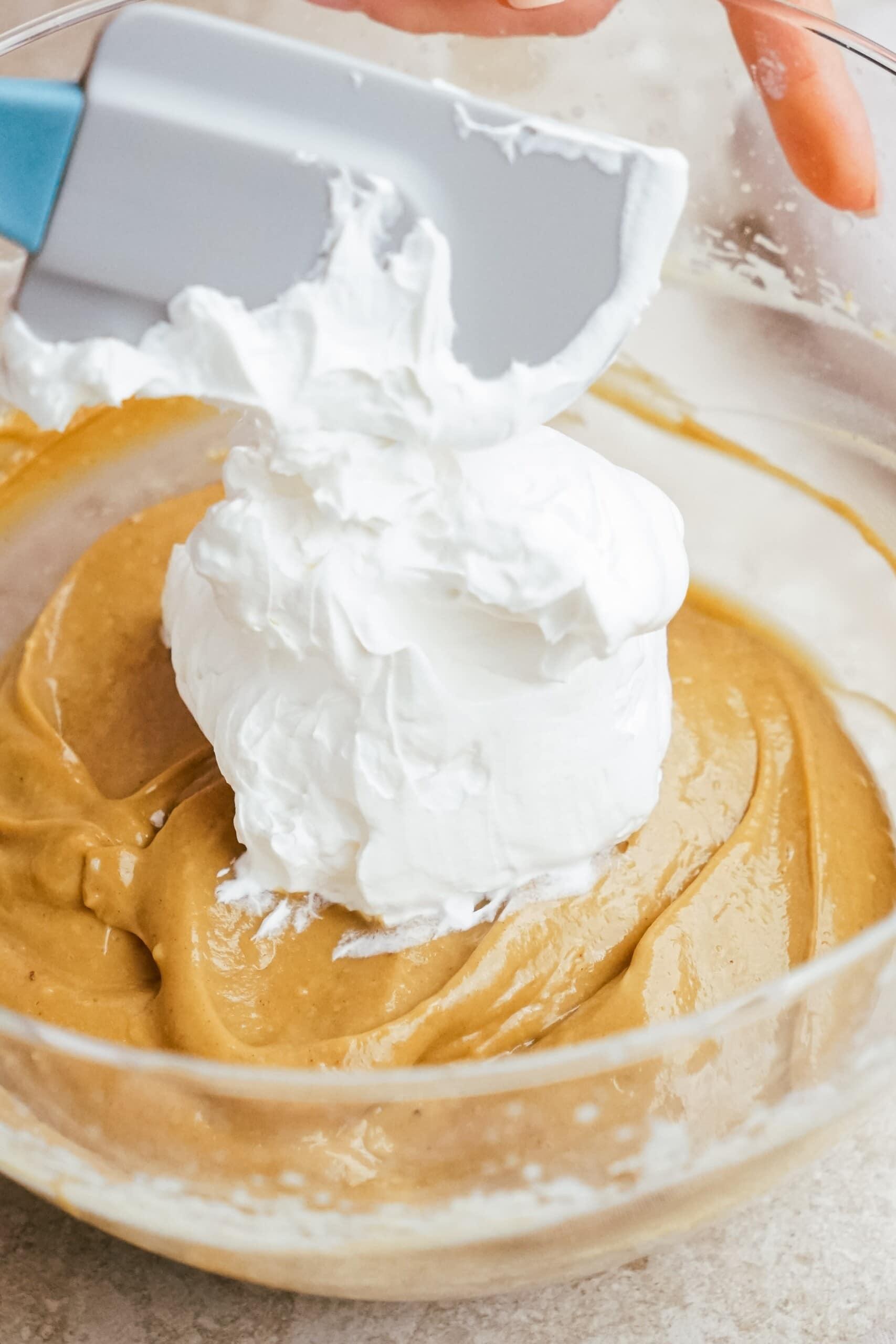 adding whipped cream to the gingerbread filling mixture