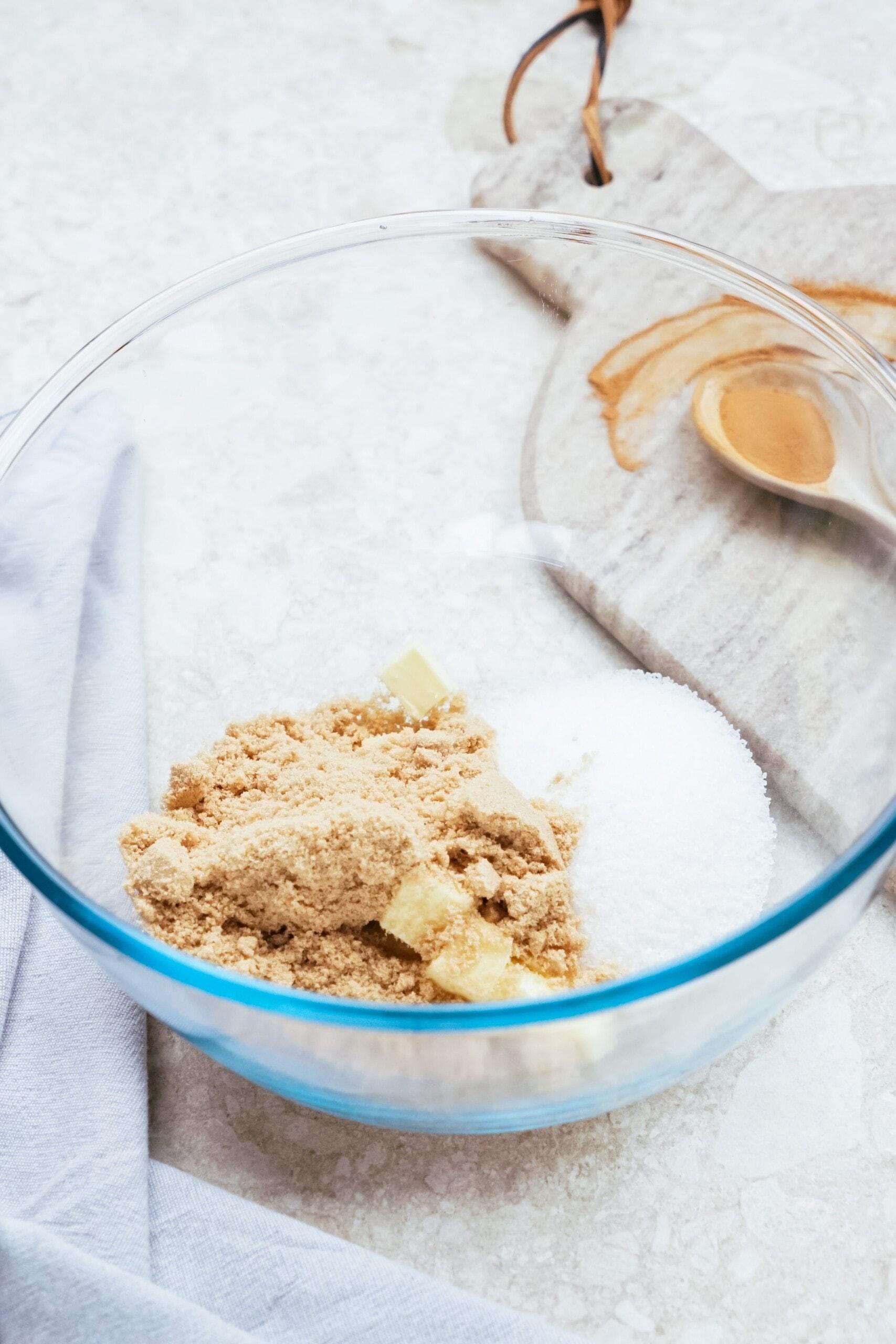 sugar and butter in a glass mixing bowl