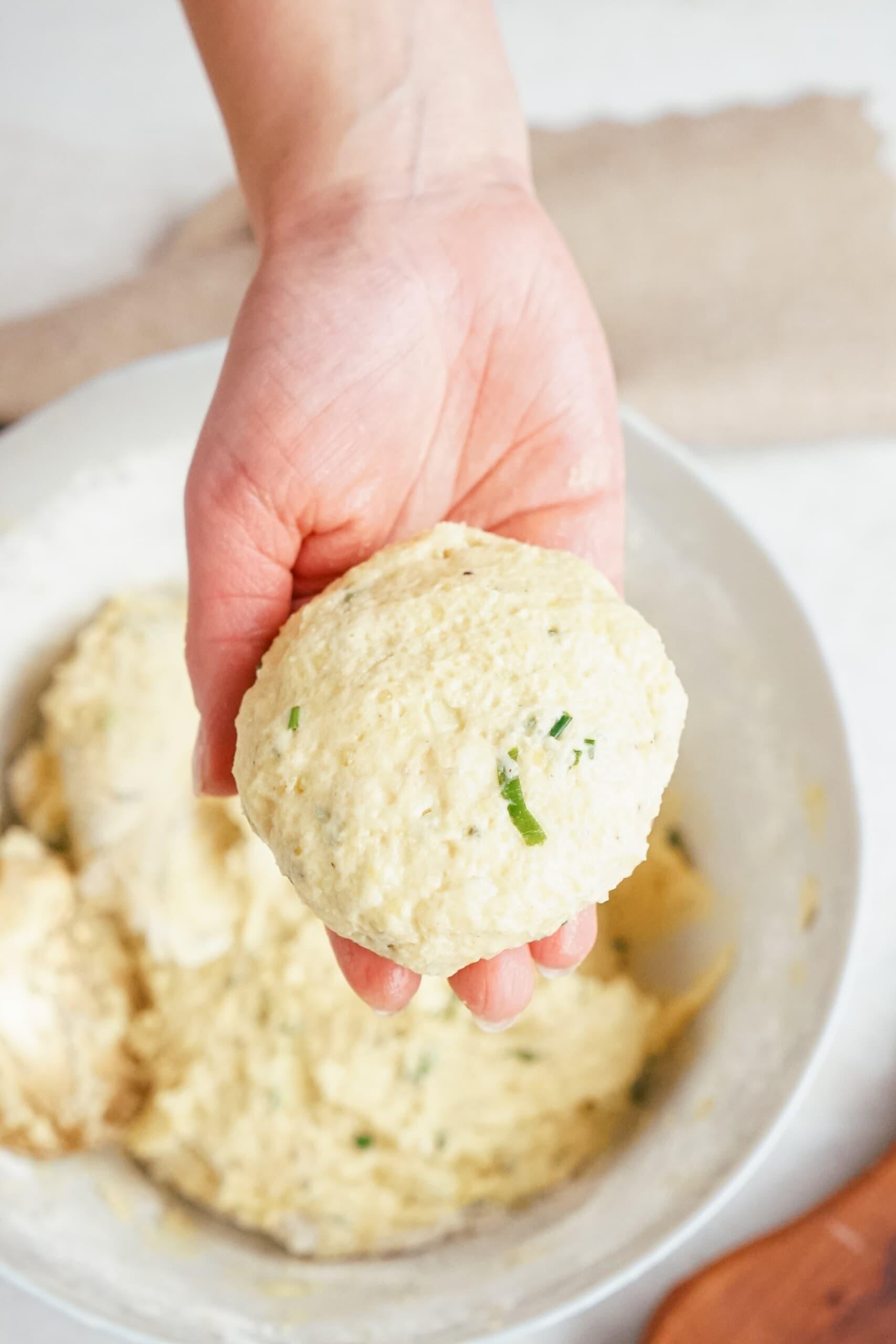 mashed potato patty in woman's hand