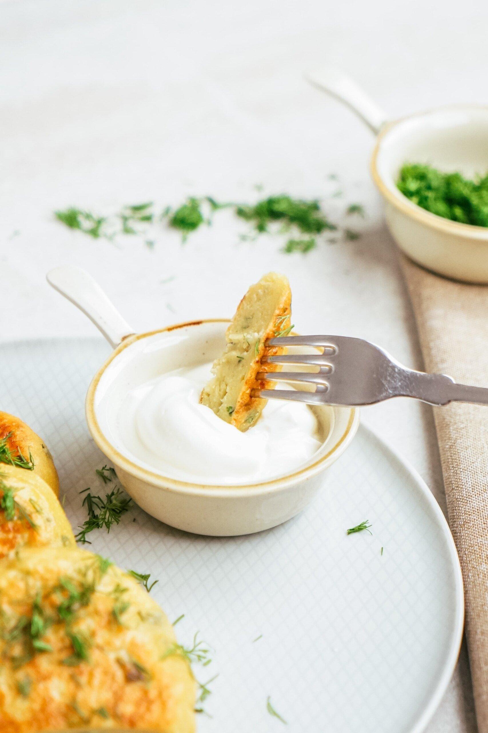 a bite of potato patty on a fork