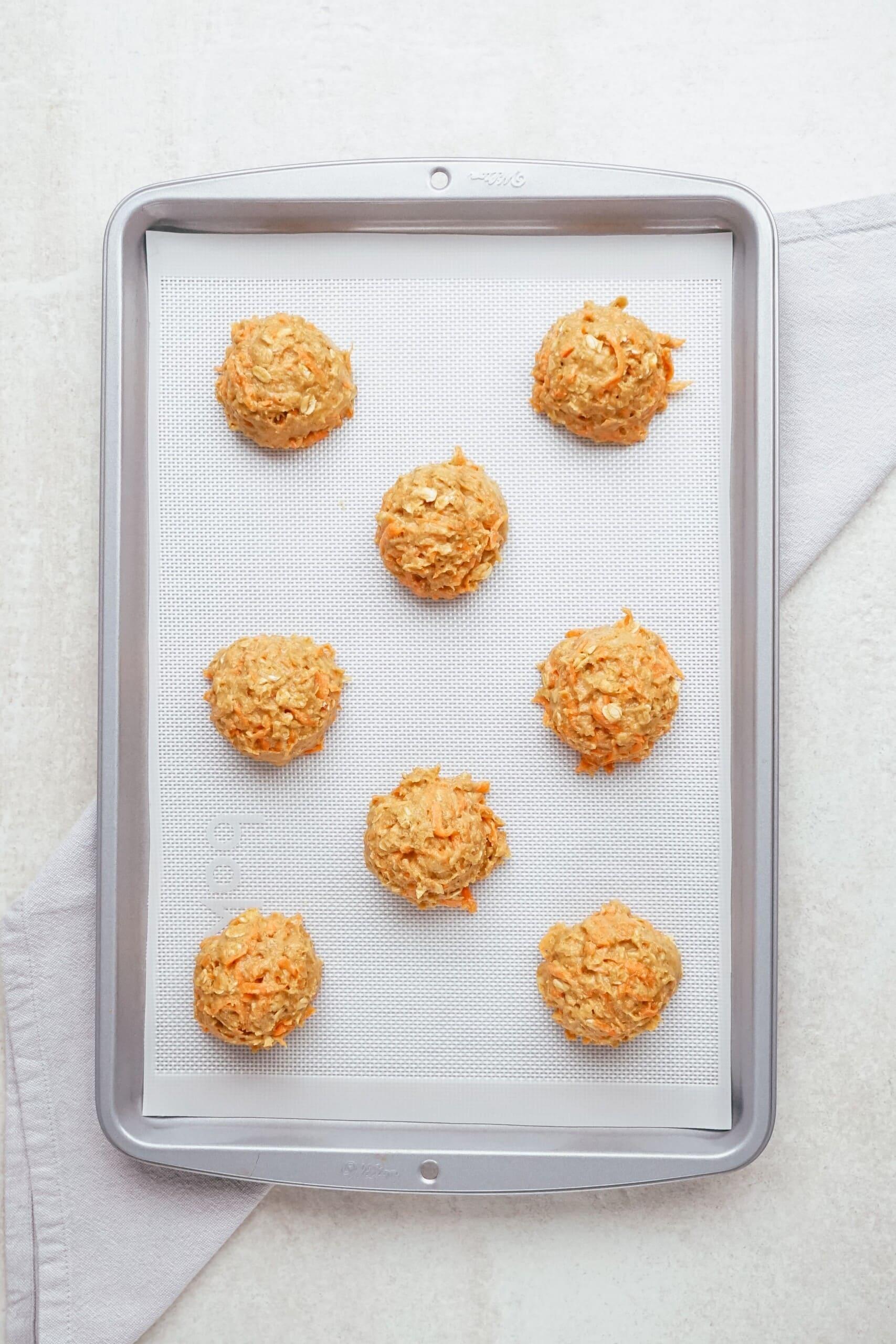 cookie dough balls on baking sheet