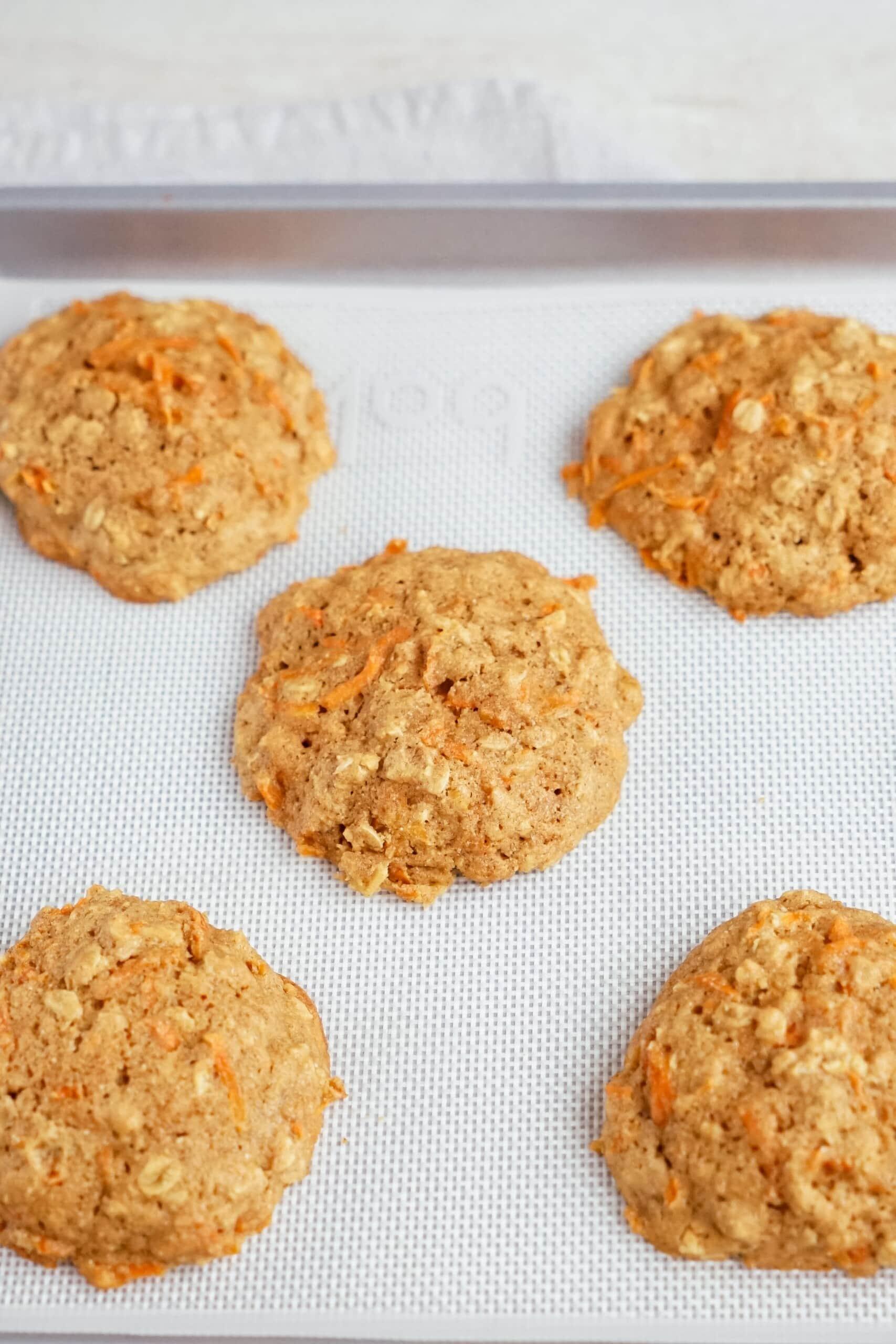 baked carrot oatmeal breakfast cookies on a baking sheet