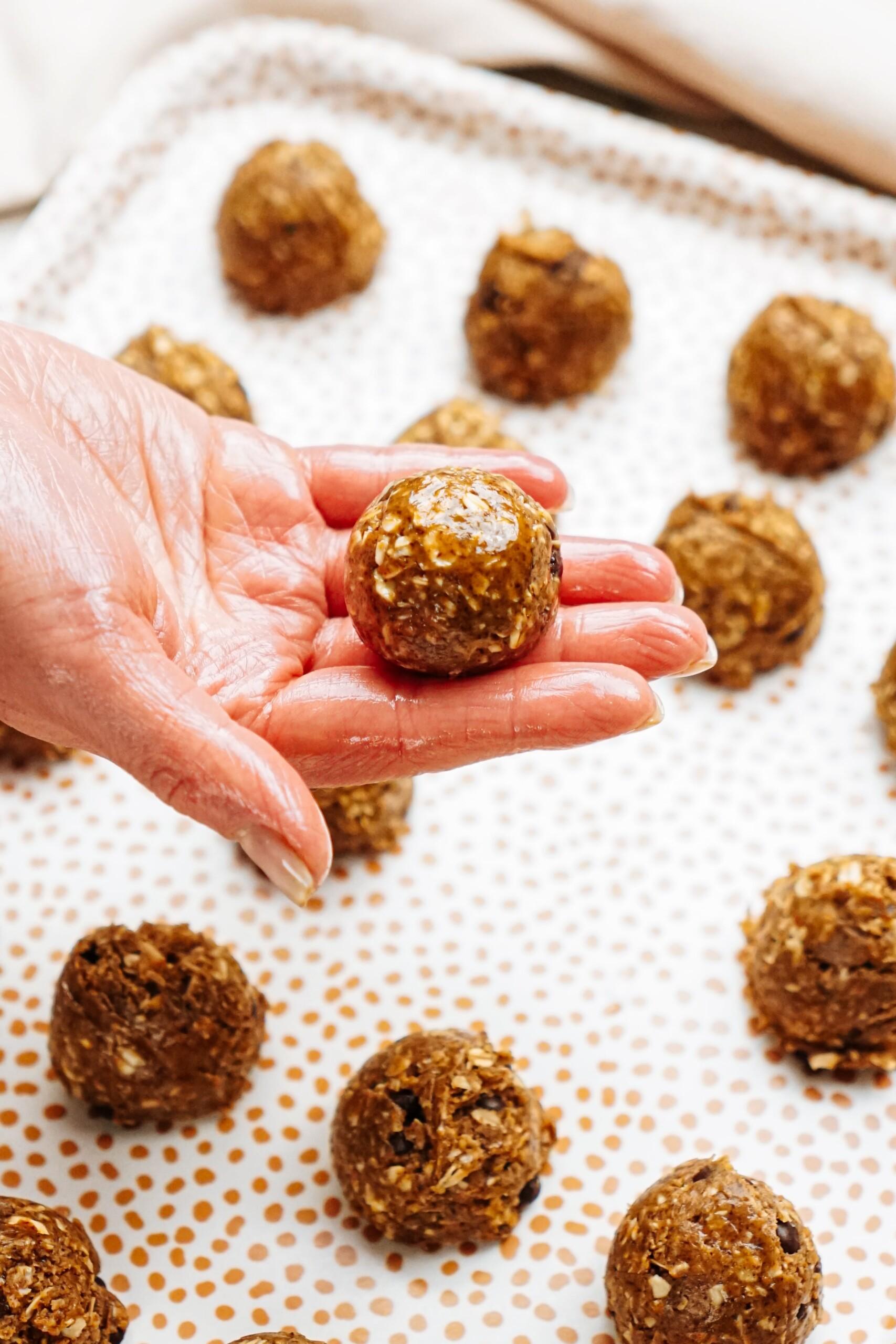 woman's hand holding an energy ball in her hand