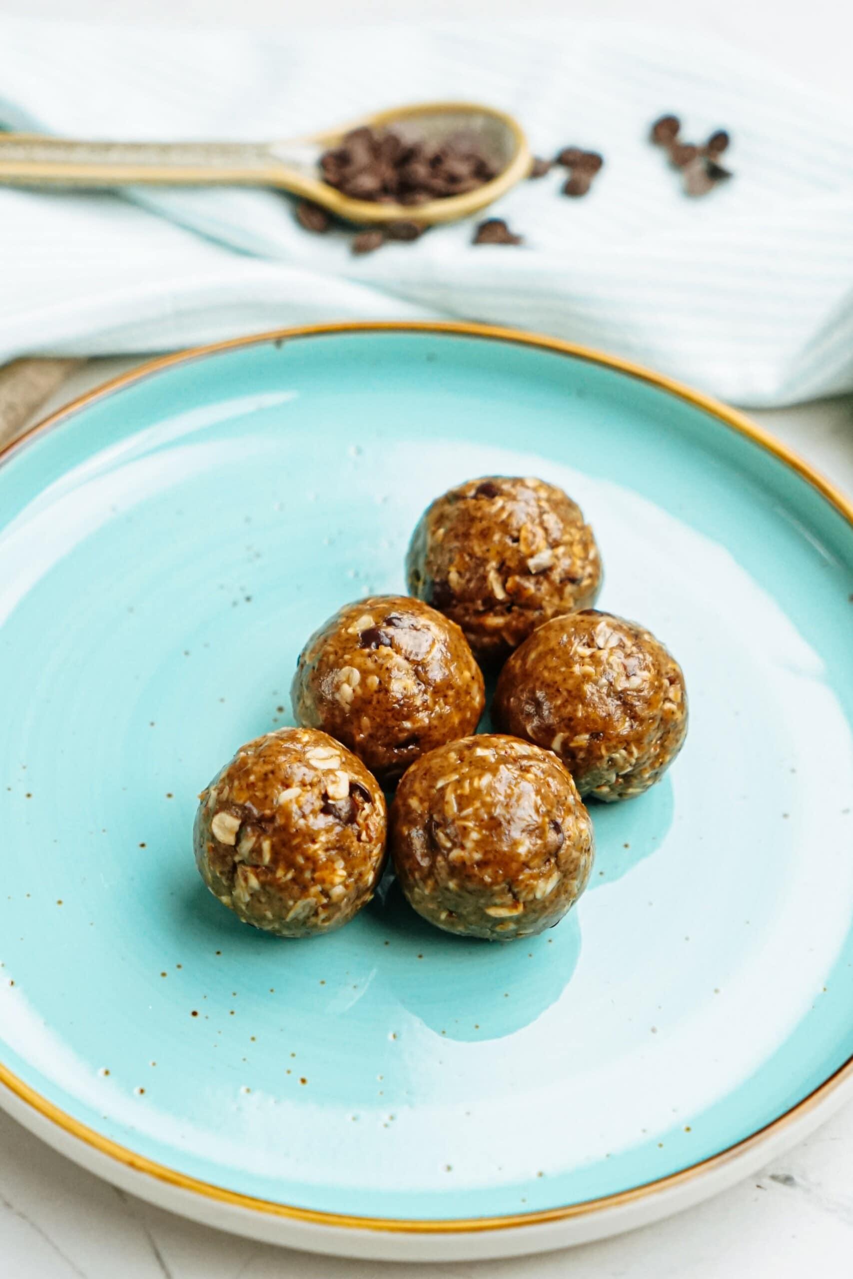 peanut butter energy balls on blue plate