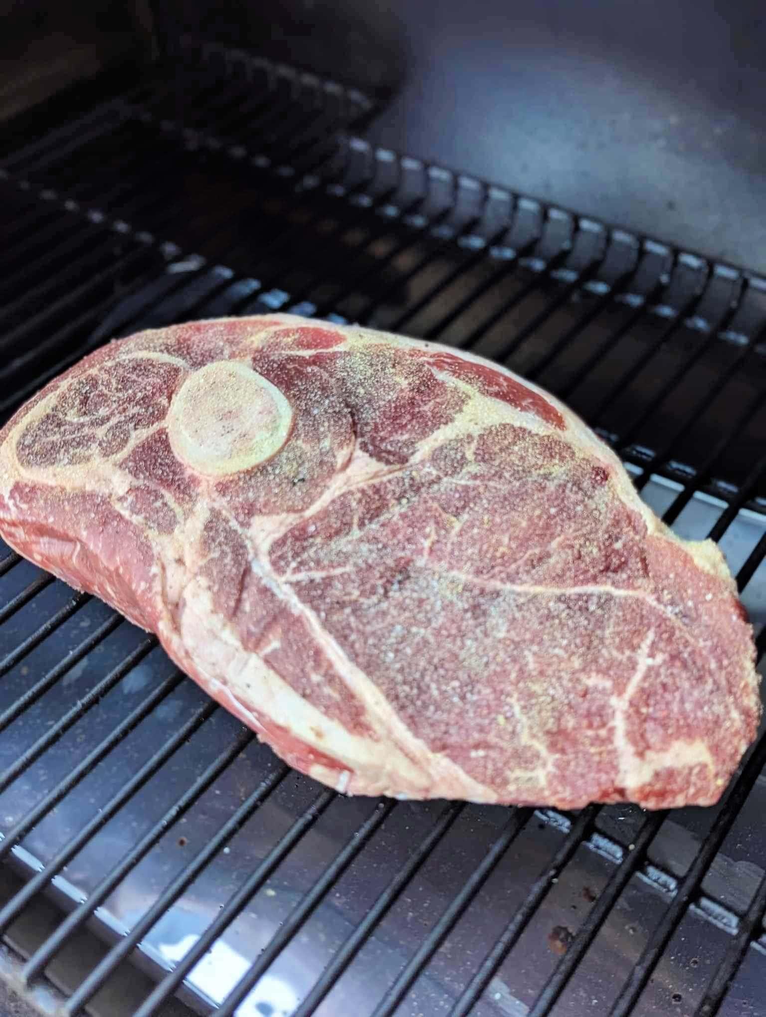 uncooked Arm Roast in the smoker