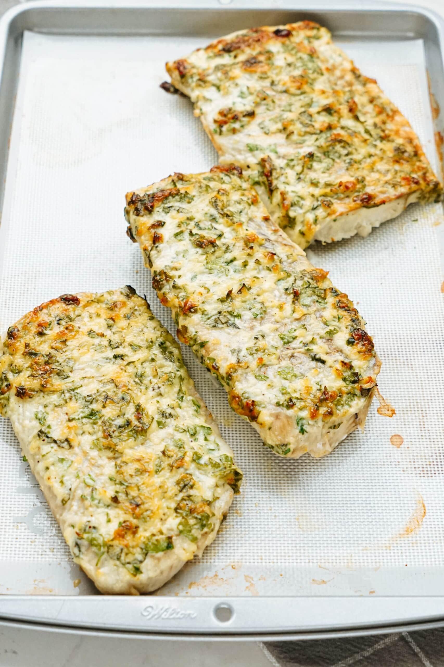 parmesan baked cod on baking sheet 