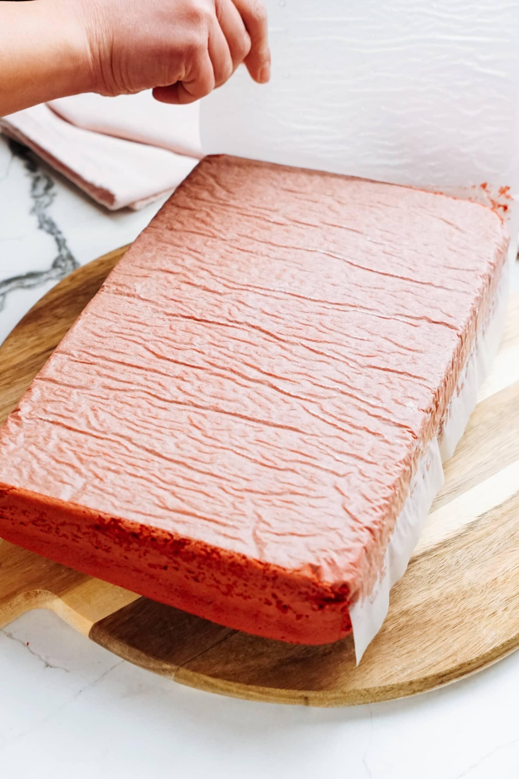 cake removed from pan with parchment paper on the bottom