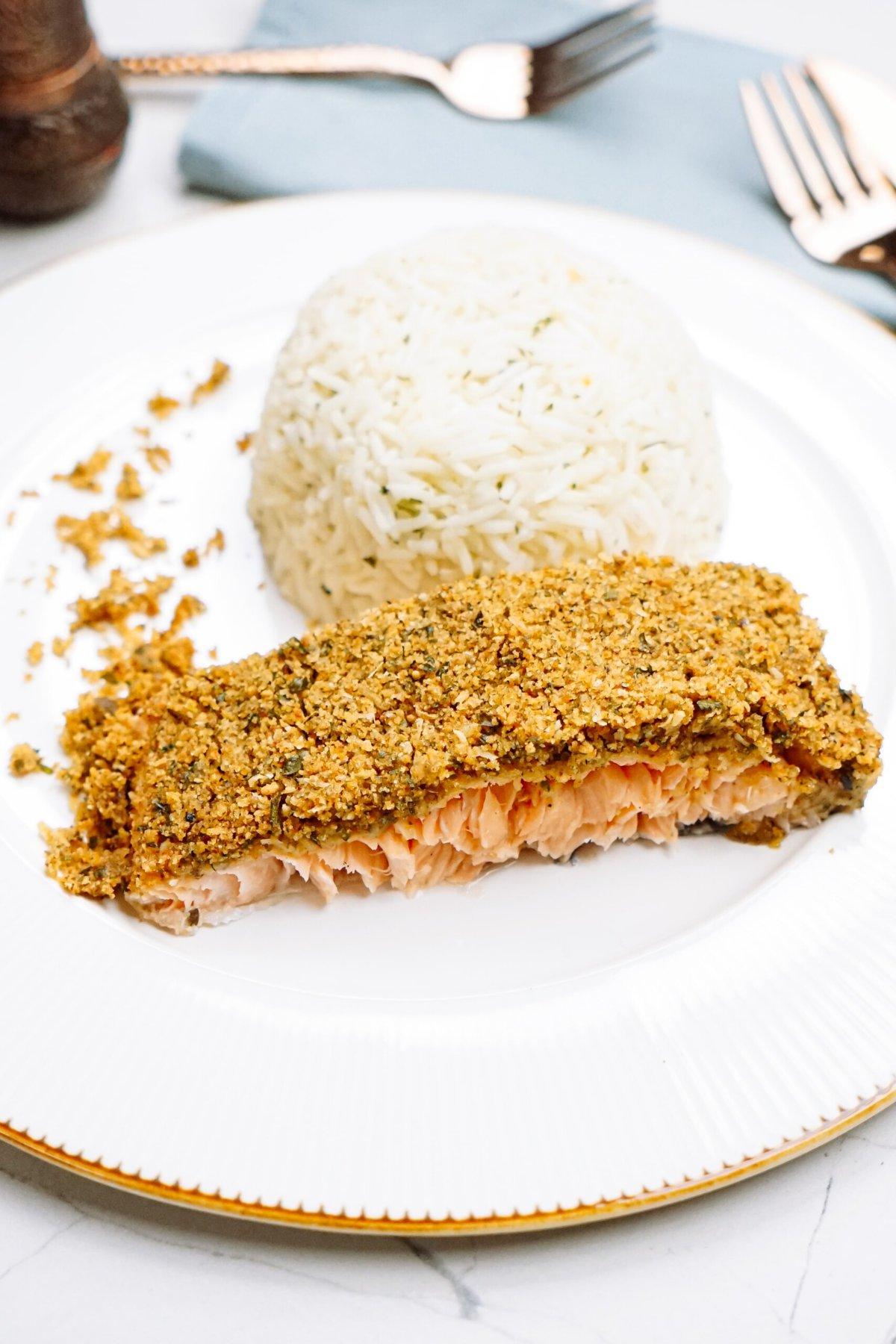 baked salmon and dome of rice on a plate