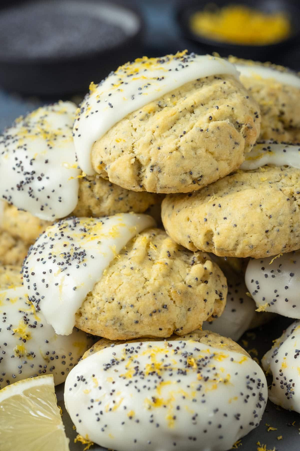 Vegan lemon poppy seed cookies stacked on top of each other.