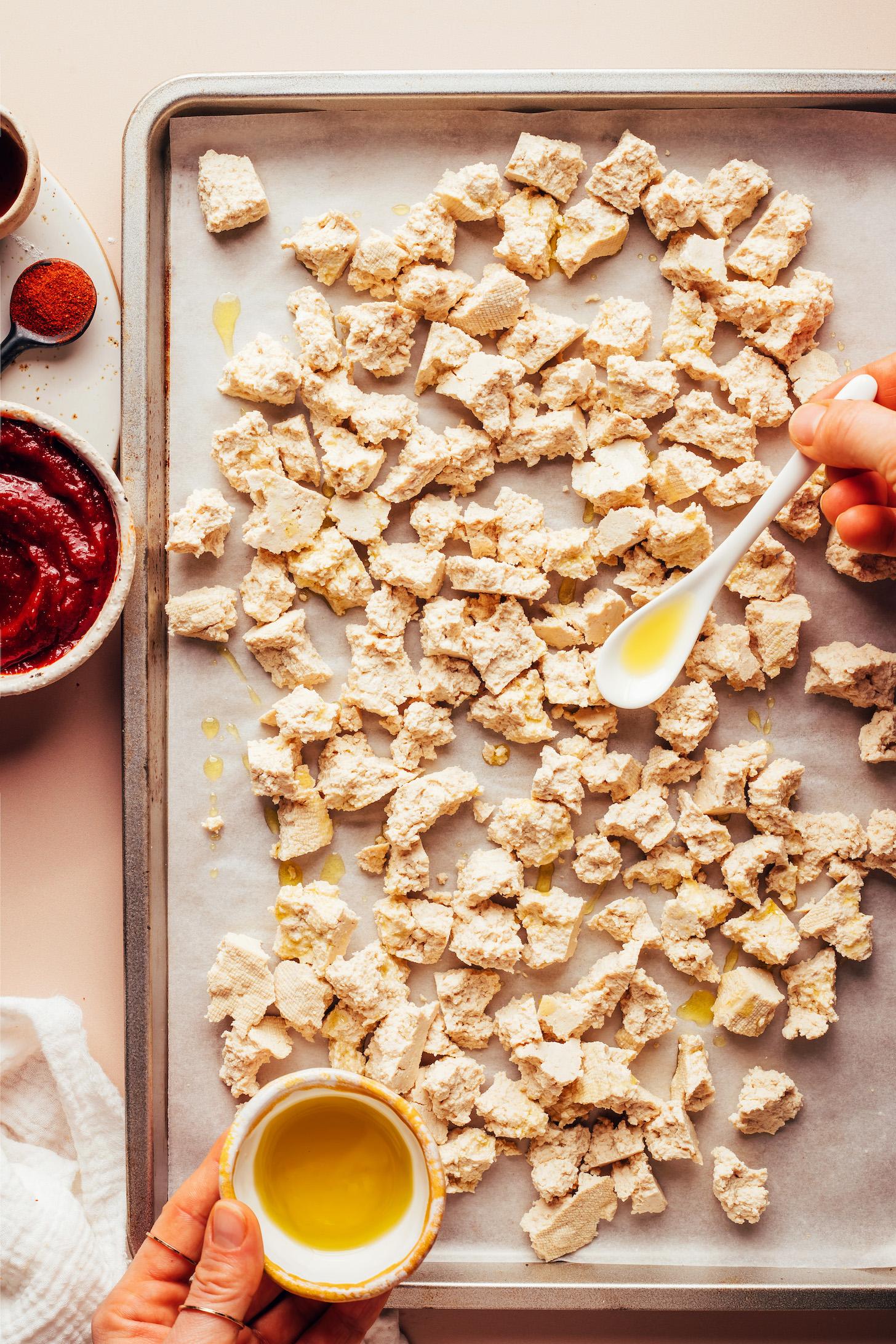 Drizzling crumbled super firm tofu with olive oil