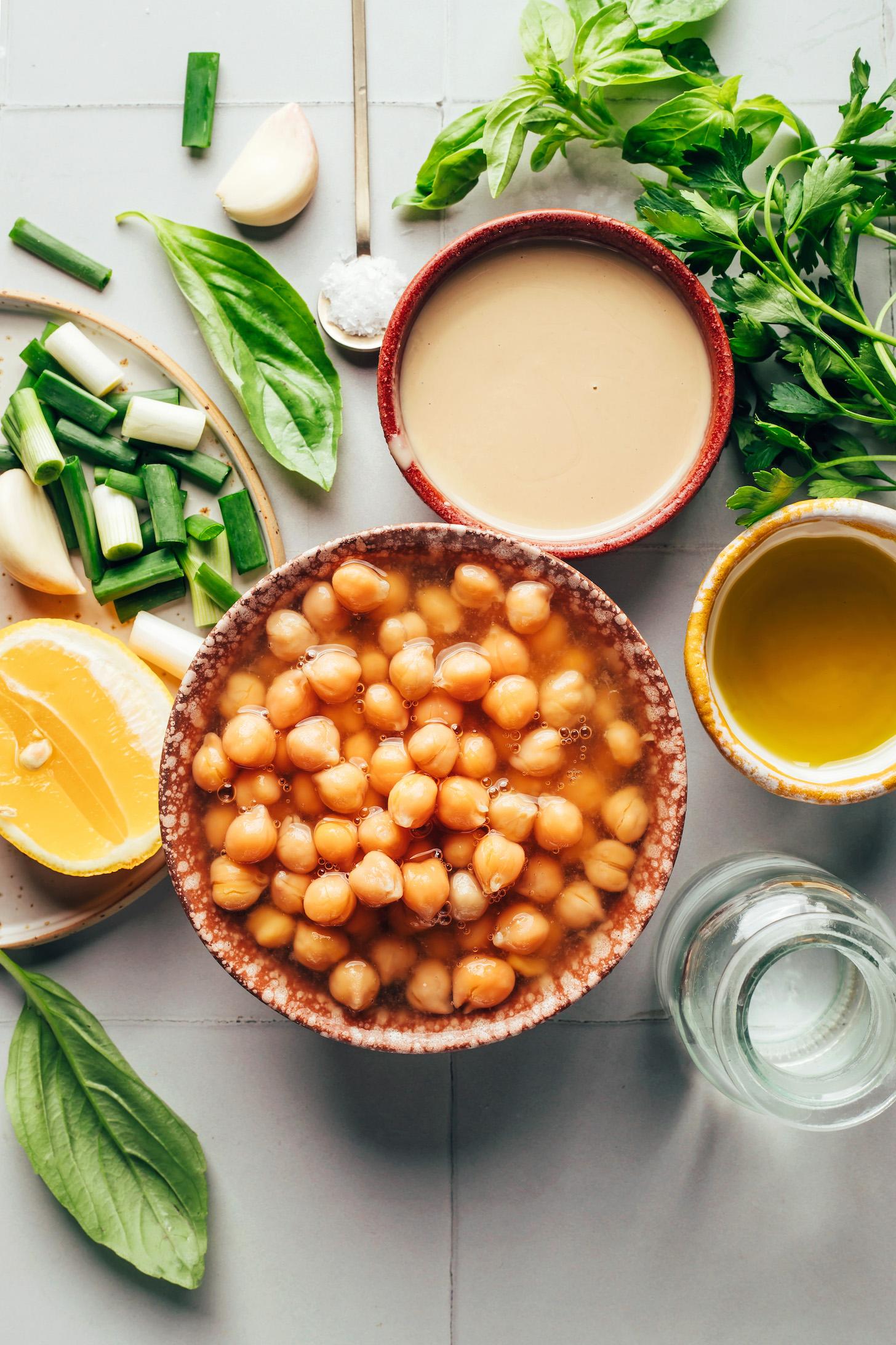 Tahini, olive oil, water, chickpeas, basil, lemon, green onion, garlic, salt, and parsley