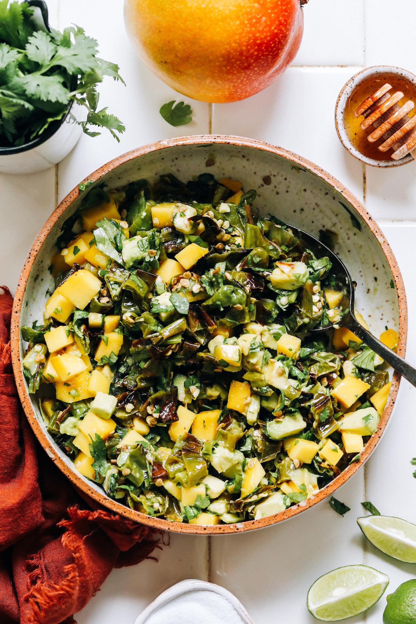 Spoon in a bowl of homemade shishito pepper mango salsa