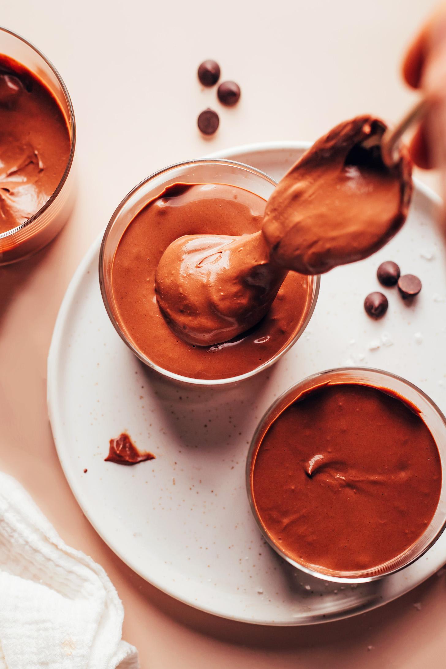 Transferring a chocolate pot de creme mixture into dessert glasses