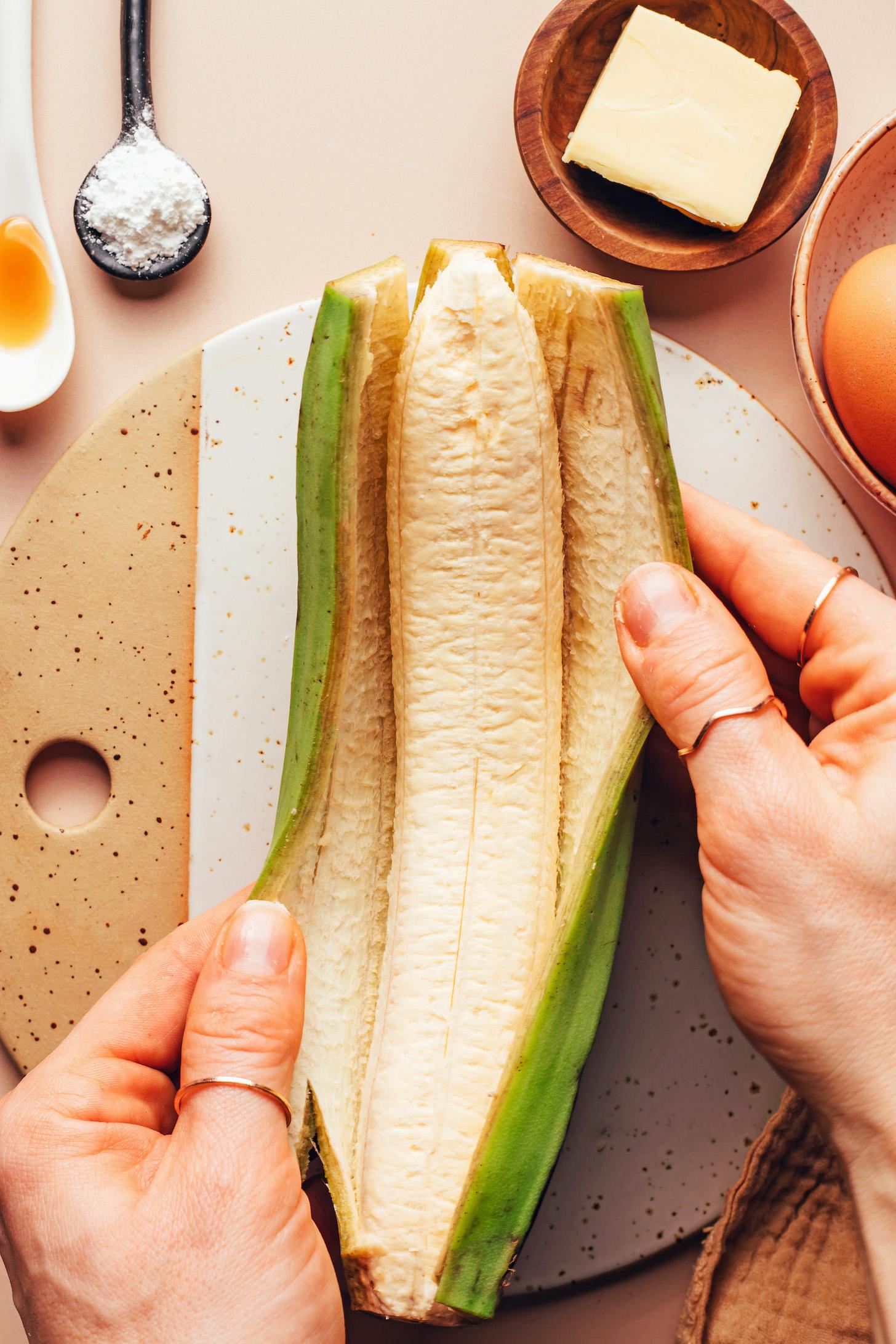 Peeling a green plantain