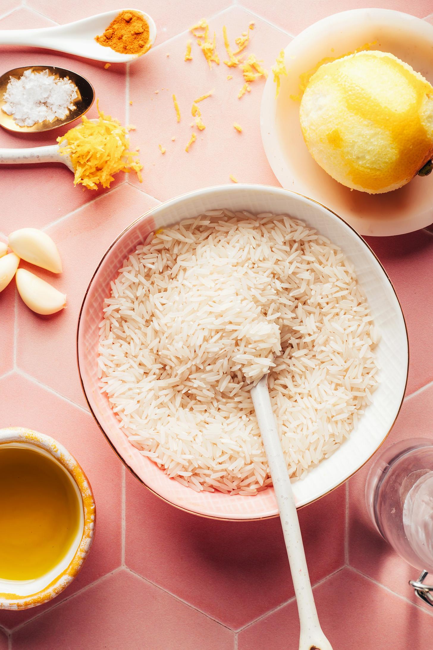 White basmati rice, olive oil, garlic cloves, lemon zest, salt, turmeric, lemon, and water