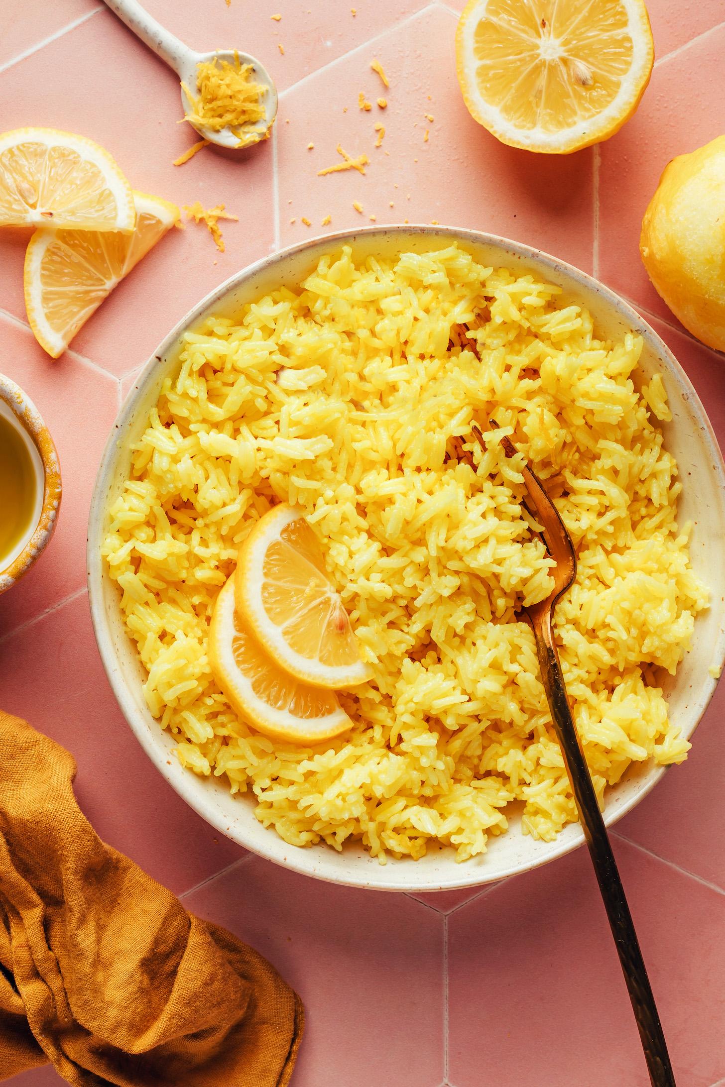 Fork resting in a bowl of our easy Greek lemon rice recipe