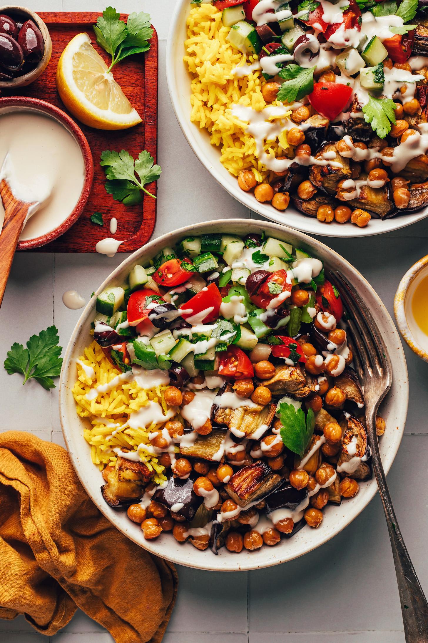 Overhead shot of two bowls of our Mediterranean-inspired chickpea nourish bowls