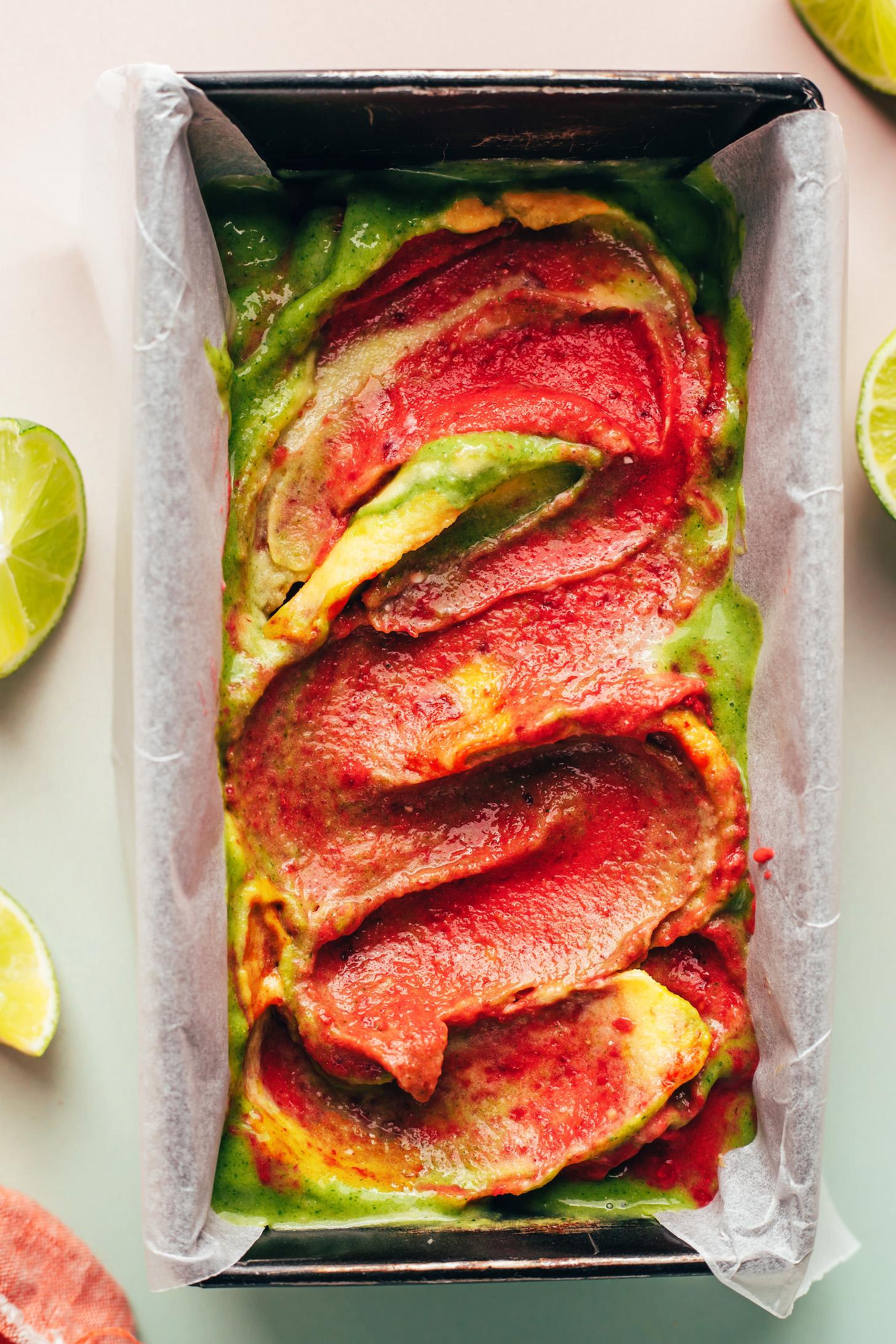 Layers of rainbow sherbet swirled together in a loaf pan